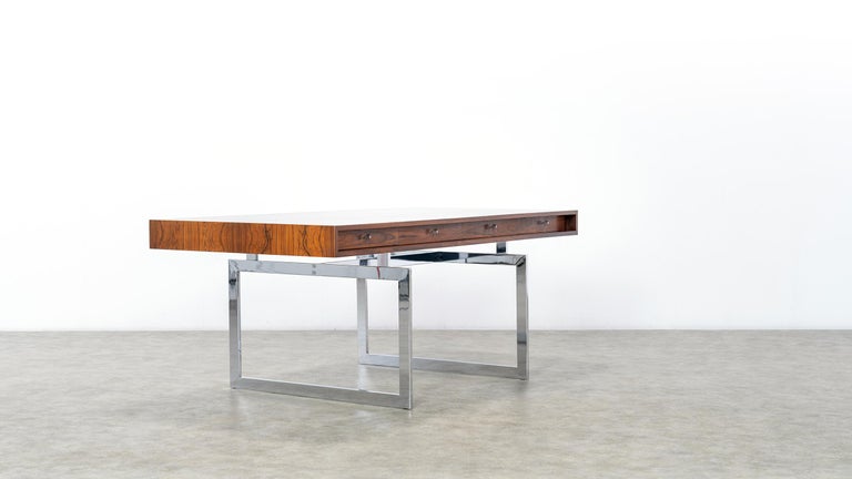 Bodil Kjaer for E. Pedersen & Søn, table model 901, 
certified Rio Rosewood and chrome steel, Denmark, 1959, completely restored.

An exceptionally beautiful version, the veneer shows an absolutely stunning pattern. Metalbase in good