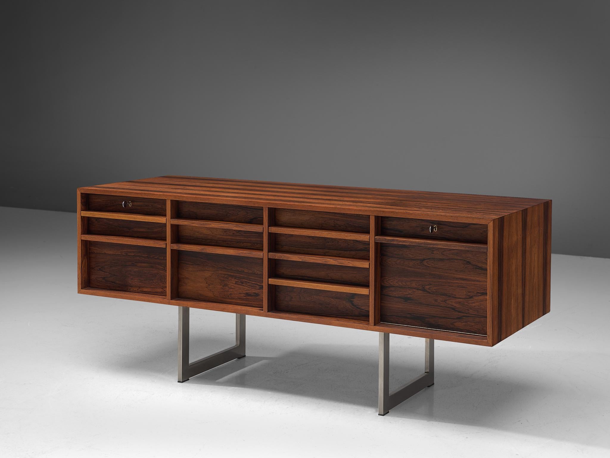Bodil Kjaer for Pederson, sideboard model 911, in rosewood and metal, by Denmark, designed 1959, this example manufactured, 1960s-1970s.

Freestanding sideboard in rosewood by Danish designer Bodil Kjaer. Absolute stunning credenza. This cabinet