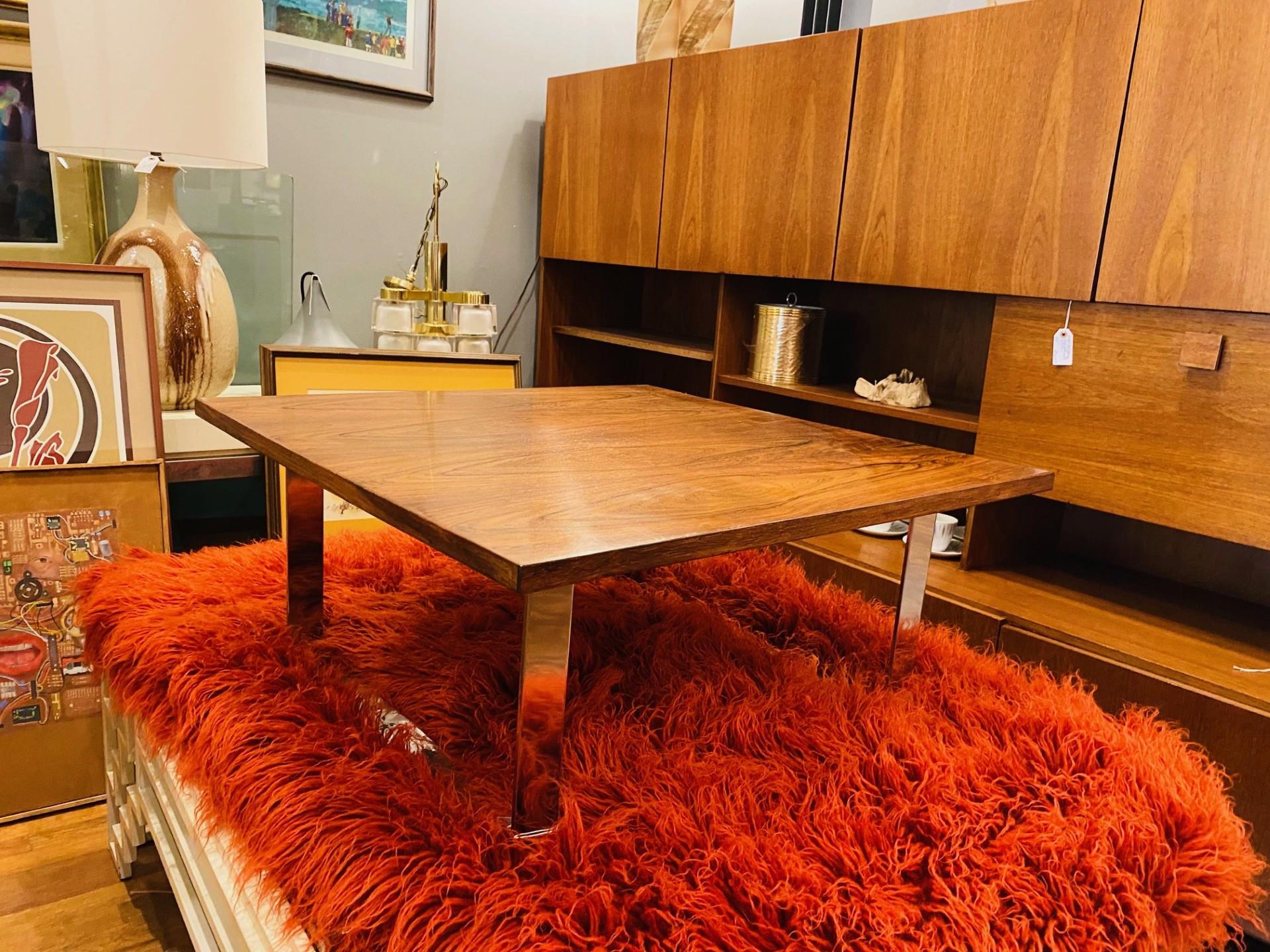 Bodil Kjaer (1932 Denmark - 1960), very rare, low, square rosewood coffee table with chromed steel frame, circa 1959. The square rosewood top on two chromed steel U-form legs is simply timeless midcentury design. Legs are detachable for easier