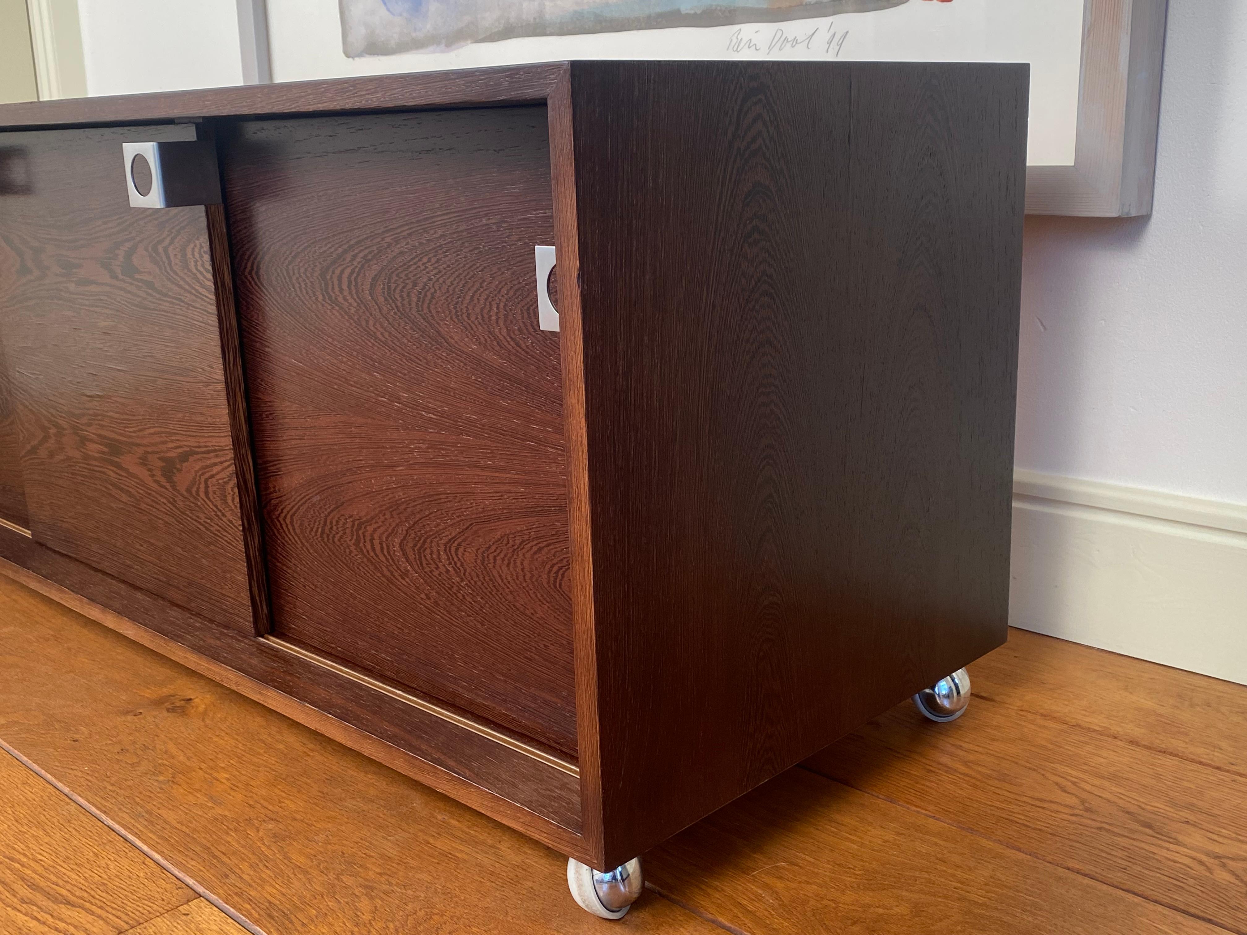 Scandinavian Modern Bodil Kjaer desk cabinet/sideboard with sliding doors on castors, Denmark 1960s For Sale