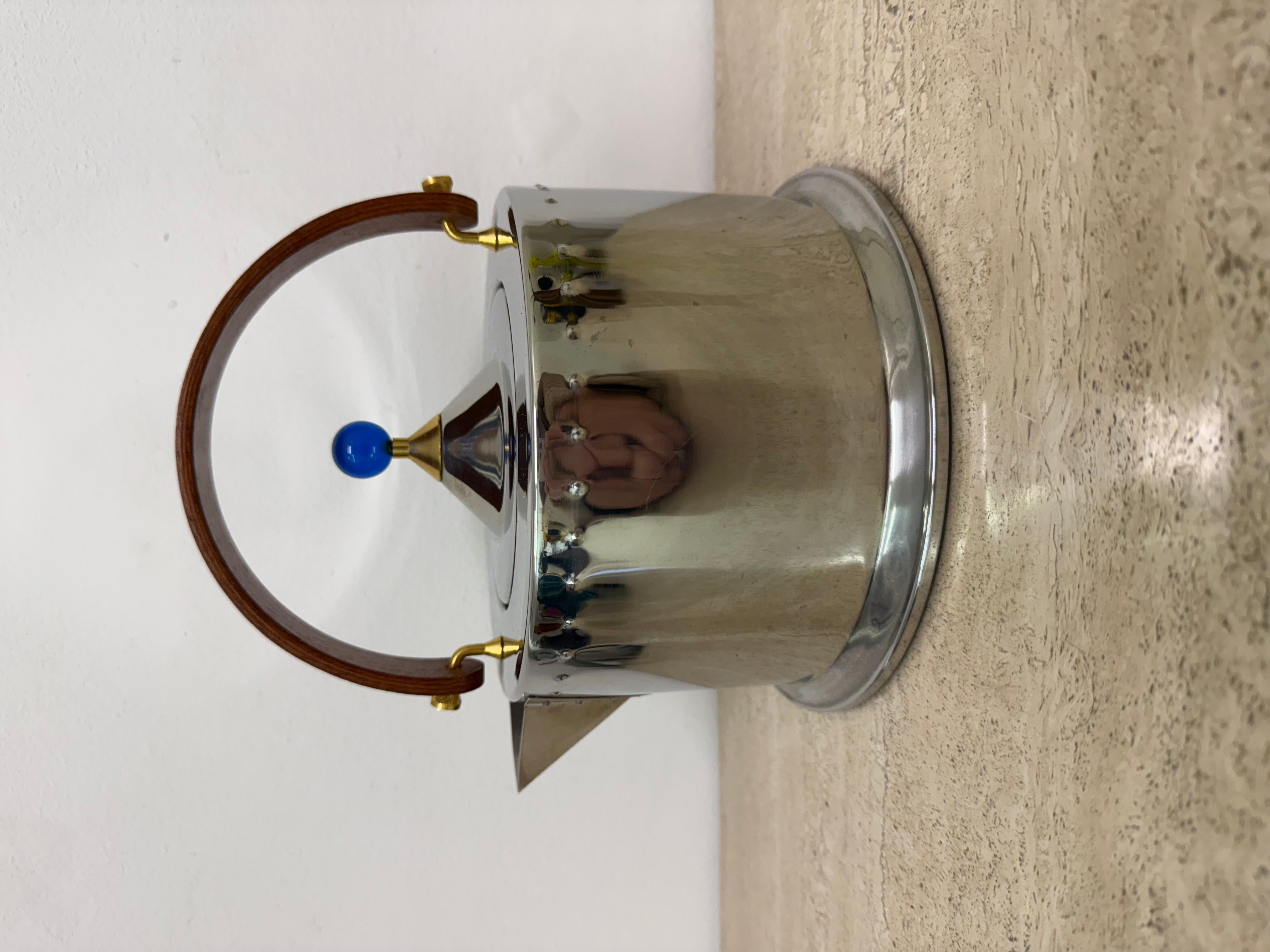 dimensions: 21cm Height, 22cm Width , 19cm Depth

Period: 1980s

Material: Metal , teak , plastic