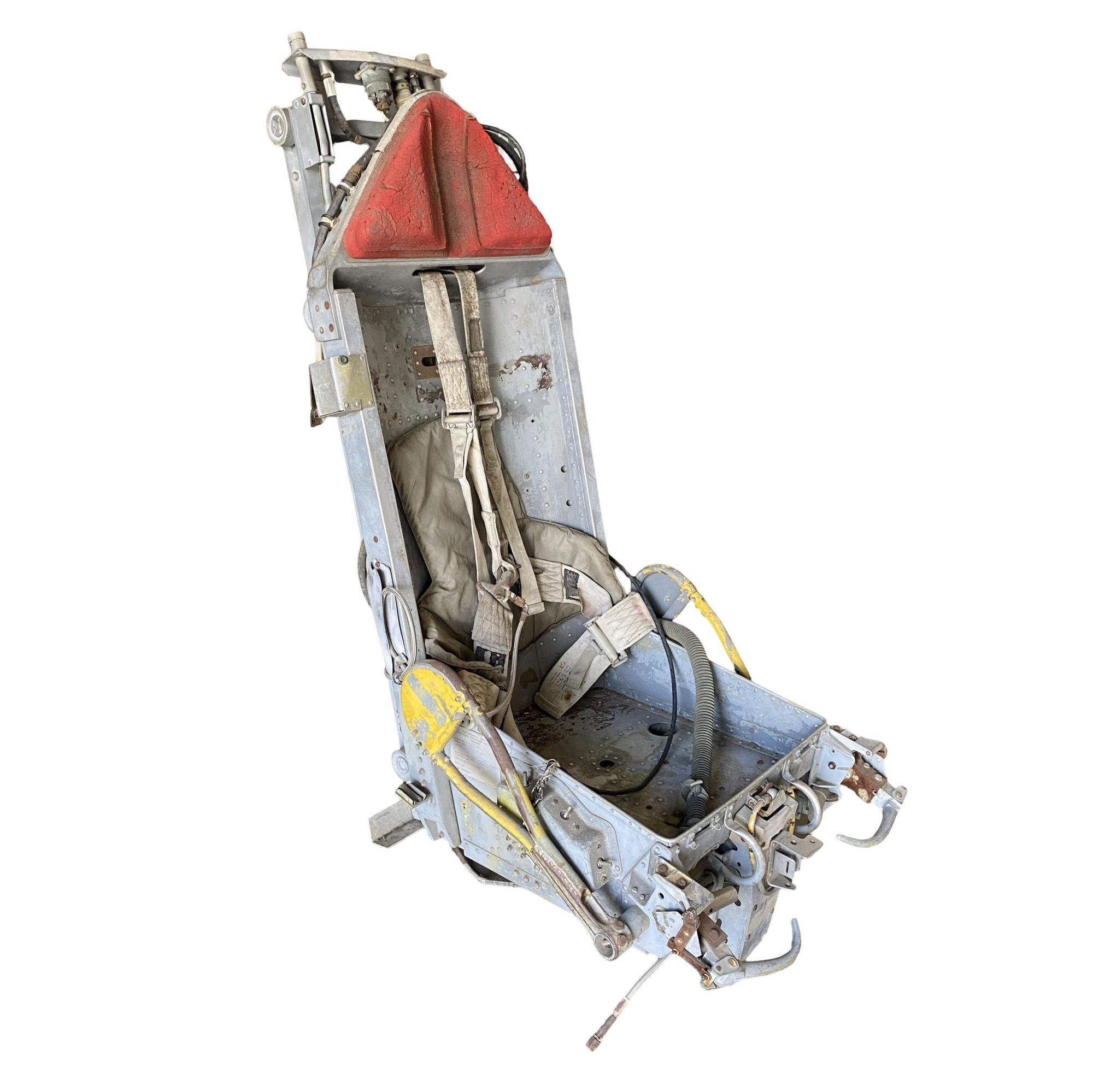 This is an ejection seat from a Boeing B-52 that is set up for training. The tag on the seat indicates that it was the Bombardier's seat which is a downward ejecting seat located on the lower deck. 

This is not a working ejection seat and it