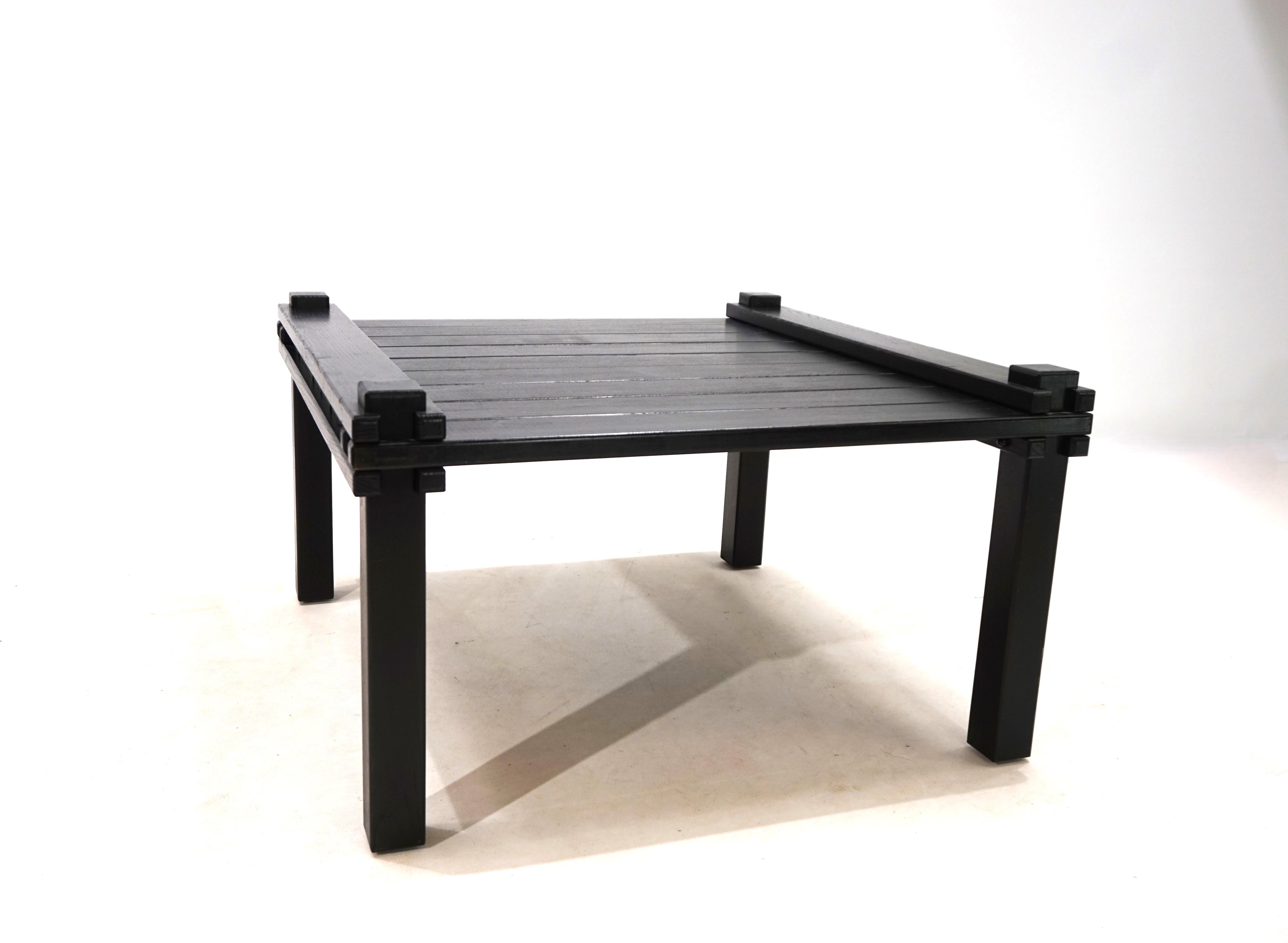 This Farmer coffee table by Bofinger made of black ash comes in excellent condition. The wooden elements of the table, which are simply put together, show minimal signs of wear and give the table its unmistakable appearance. One of Gerd Lange's
