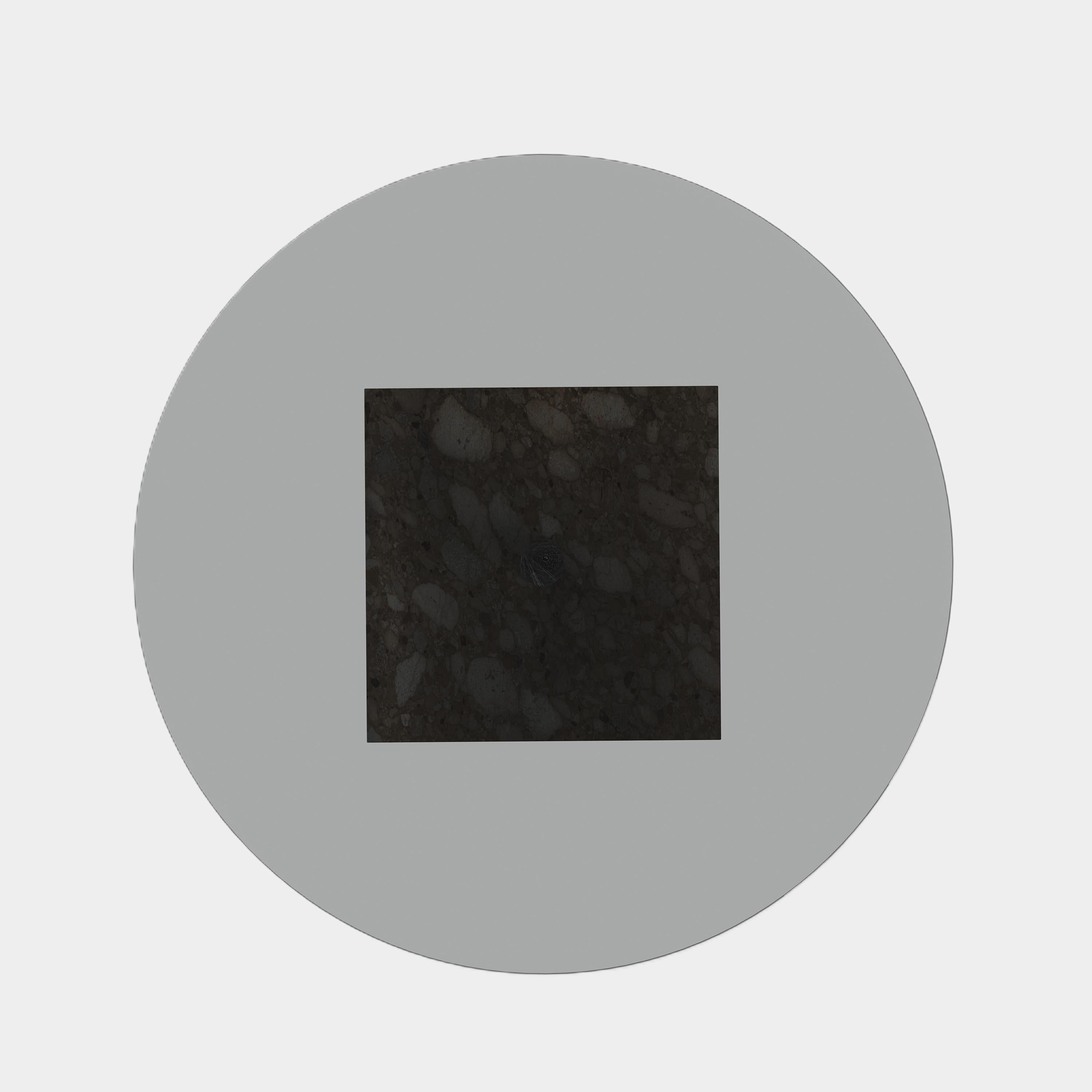 This statement-making coffee table features a rectangular marble base with unique natural veining, topped with a sleek glass surface. Its modern silhouette and contrasting materials create a striking focal point for your living area. This design is