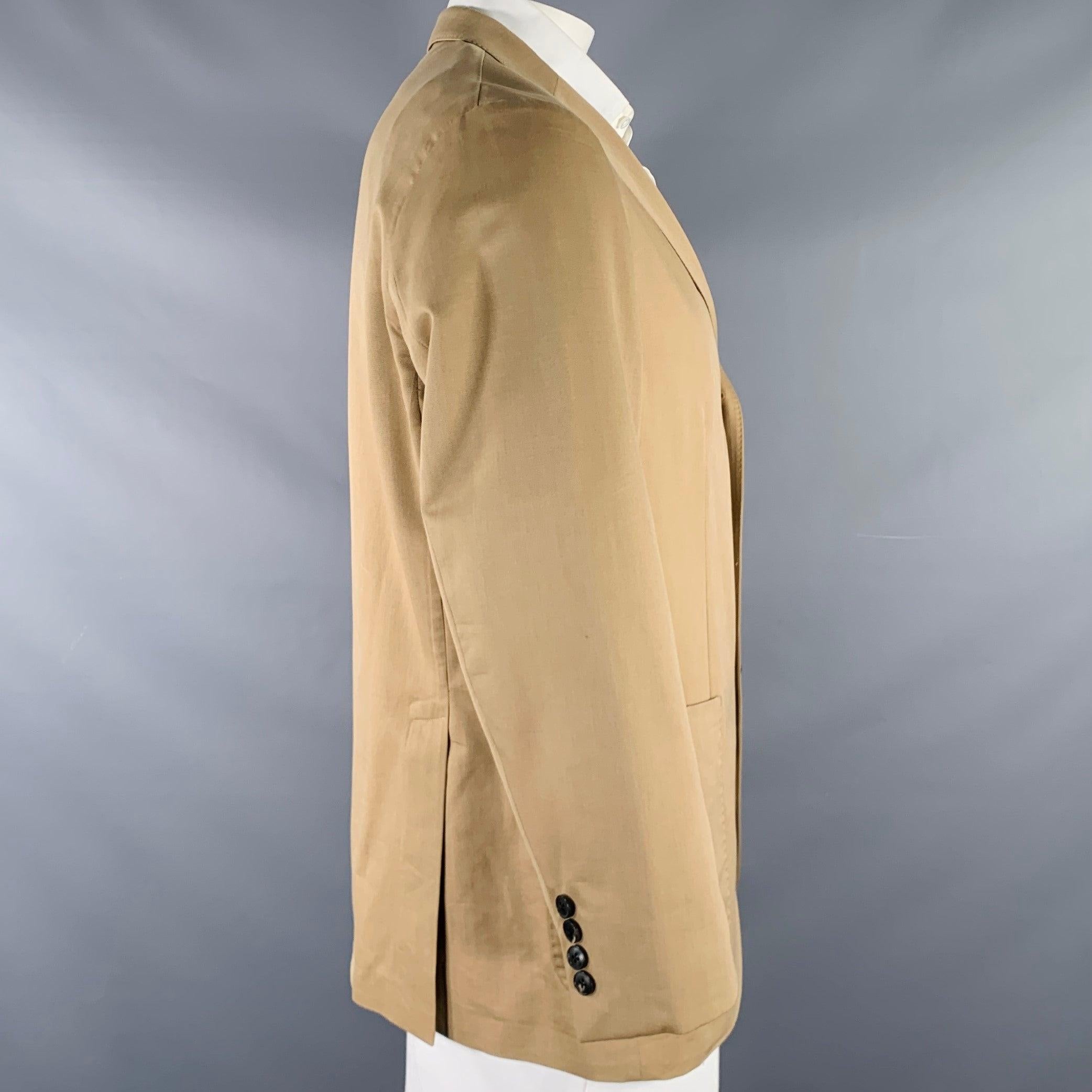 BOGLIOLI sport coat
in a beige wool cotton blend fabric featuring a single breasted style, notch lapel, double vented back, and three button closure. Made in Italy.Excellent Pre-Owned Condition. 

Marked:   IT 54 

Measurements: 
 
Shoulder: 17