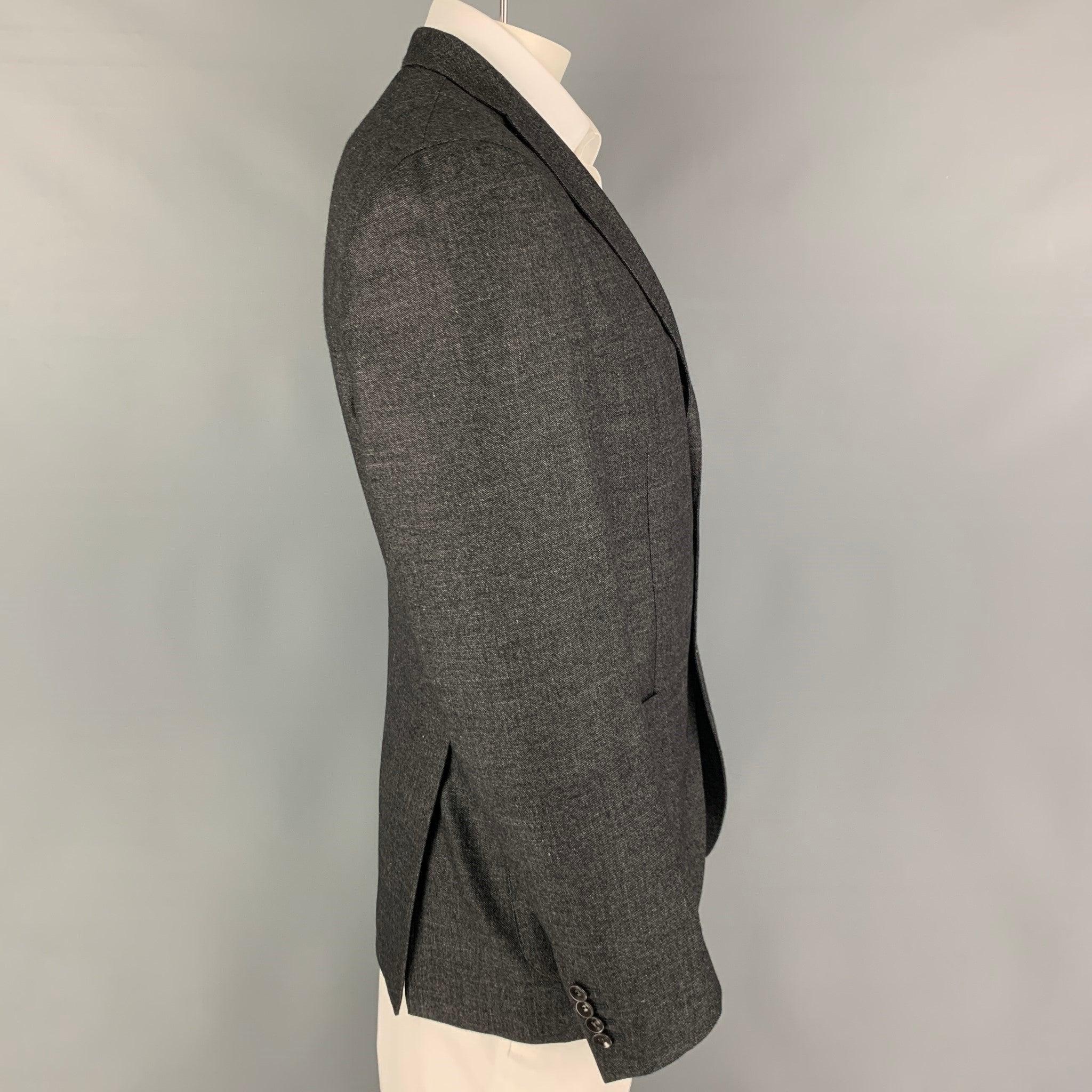 BOGLIOLI sport coat comes in a grey charcoal wool blend featuring a notch lapel, patch pockets, double back vent, and a double button closure. Made in Italy. Excellent Pre-Owned Condition. 

Marked:   50 

Measurements: 
 
Shoulder: 17 inches