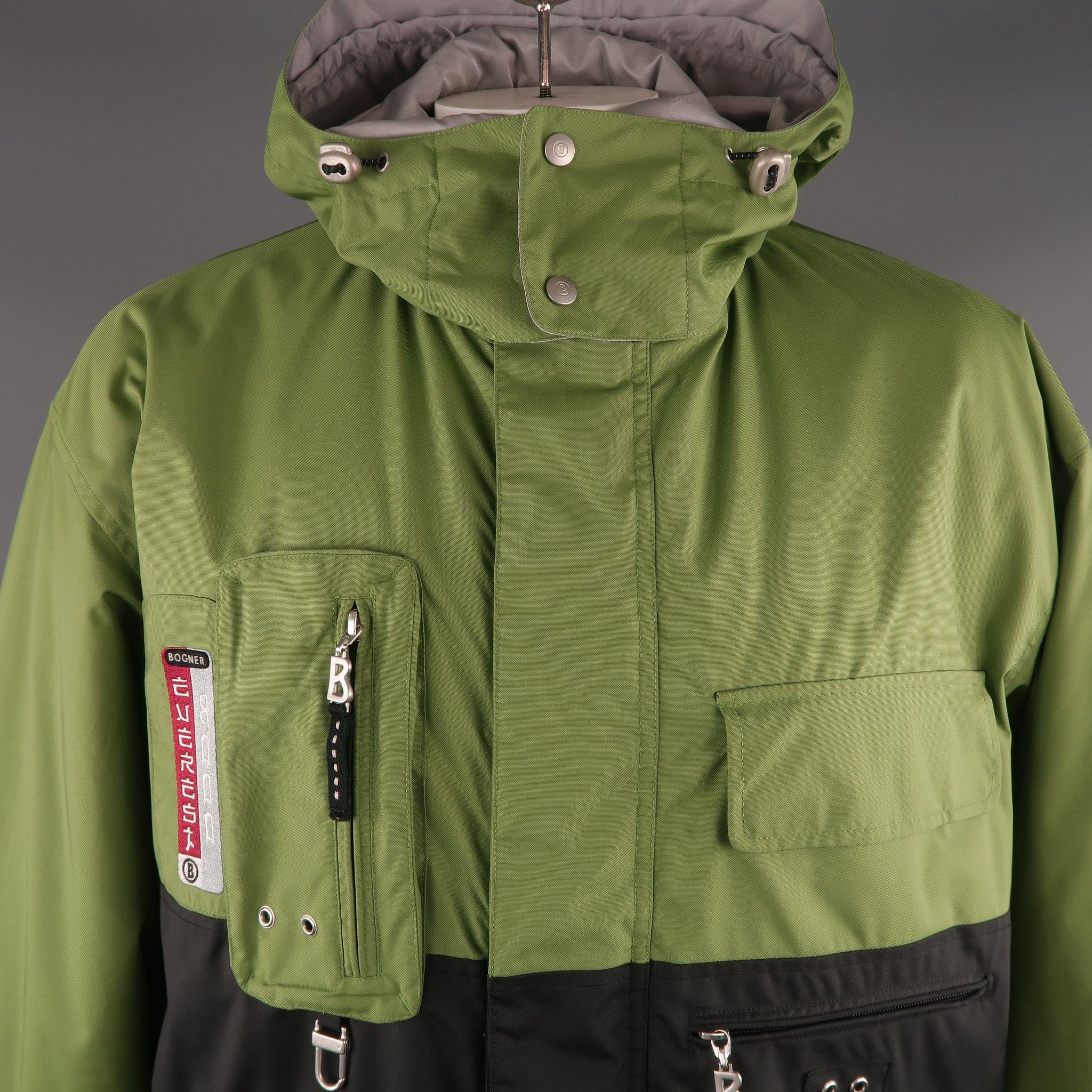 BOGNER Ski Jacket comes in green, black and grey tones in a polyamide material, with zip and cargo  pockets, snaps, drawstring, hood and zip up.
 
Excellent Pre-Owned Condition.
Marked: 40
 
Measurements:
 
Shoulder: 24 in.
Chest: 51 in.
Sleeve: