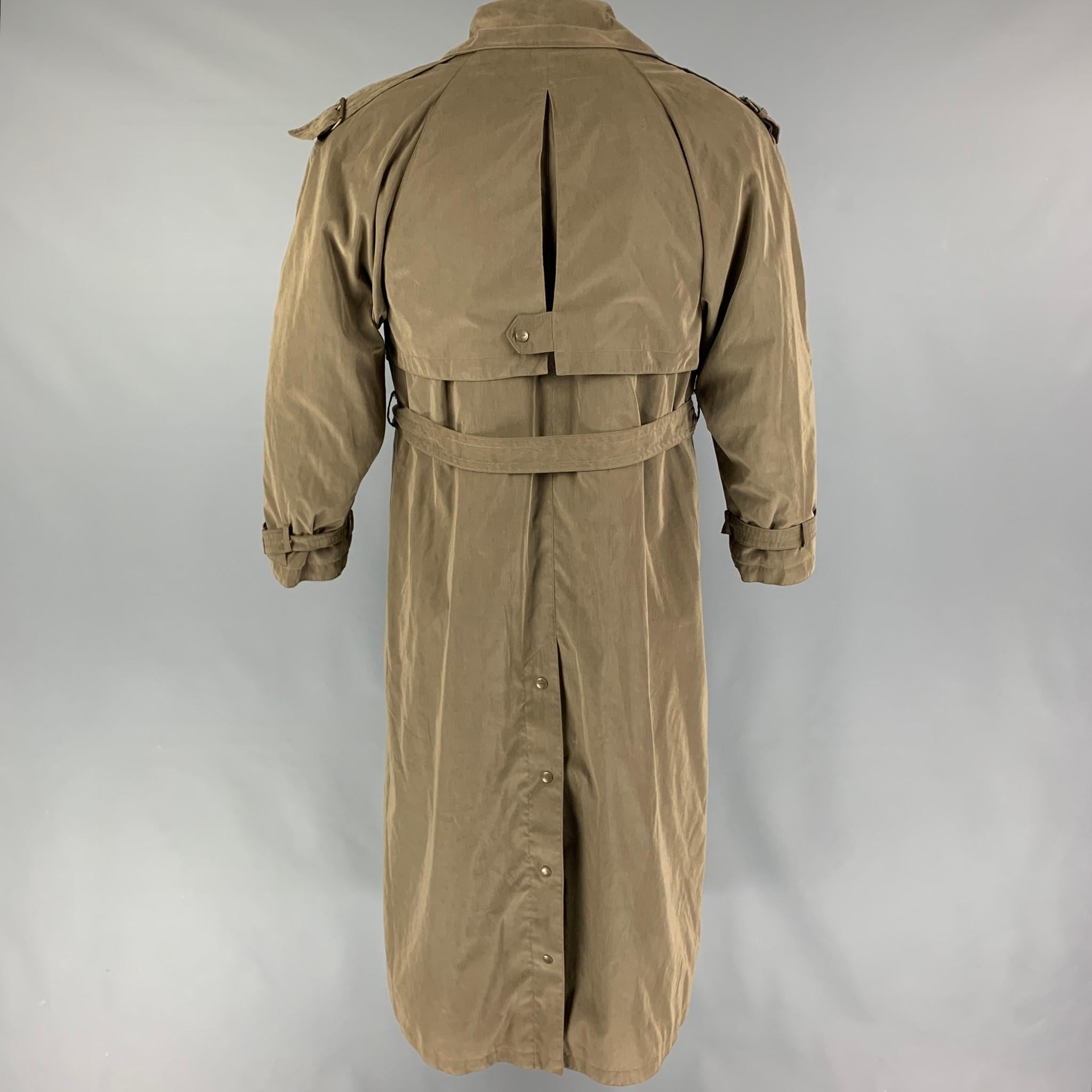 BOGNER coat comes in a olive material featuring a detachable fur liner, belted, front pockets, single back vent, and a double breasted closure. 

Very Good Pre-Owned Condition.
Marked: J / 72

Measurements:

Shoulder: 17 in.
Chest: 42 in.
Sleeve: