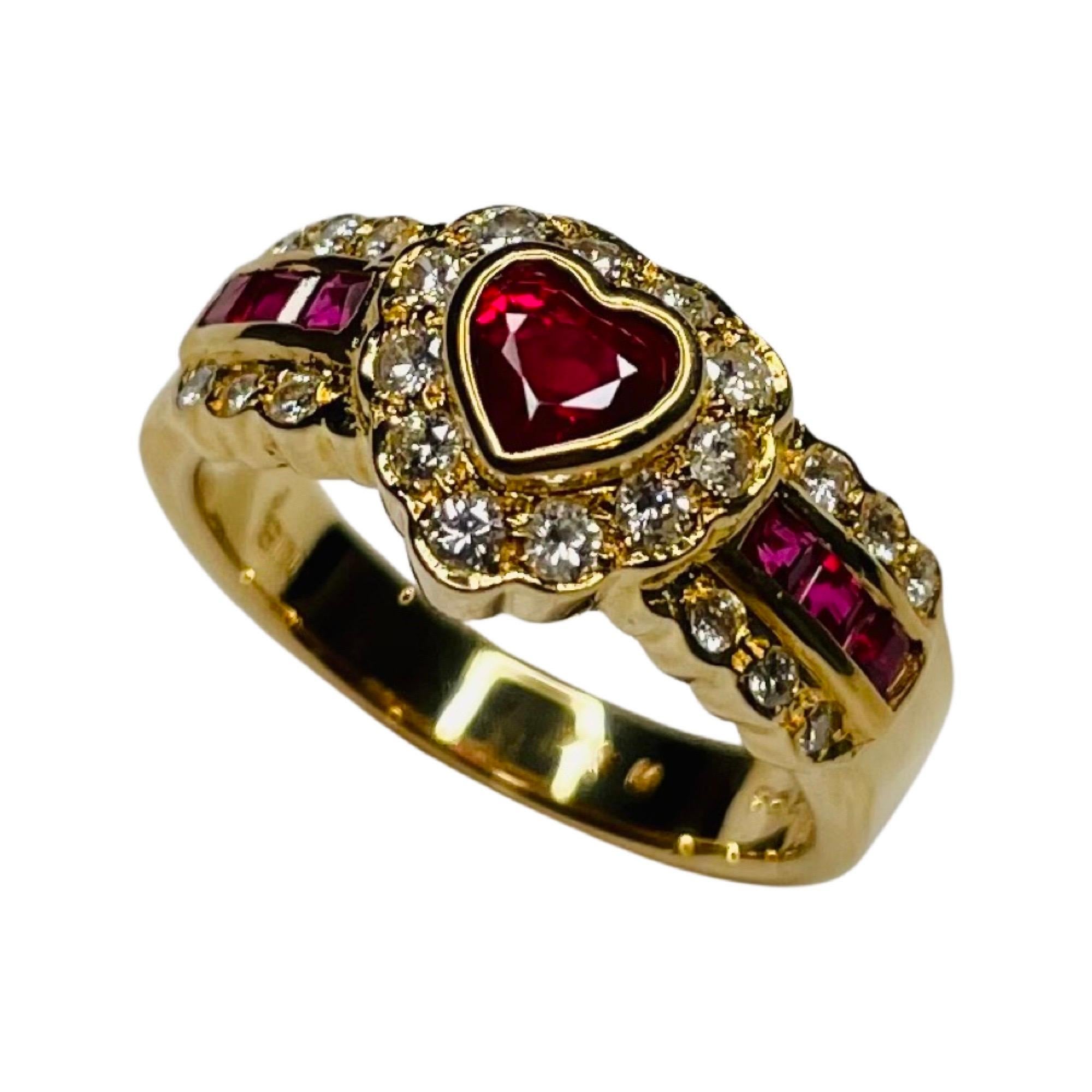 Bogo 18K Yellow Gold Diamond and Ruby Heart Shaped Ring. The natural Ruby is 9.5 mm x 9.75 mm.  It is bezel set, weighing 0.53 carats. The side rubies are square cut and channel set and weigh 0.31 carats. There is a total ruby weight of 0.84 carats.