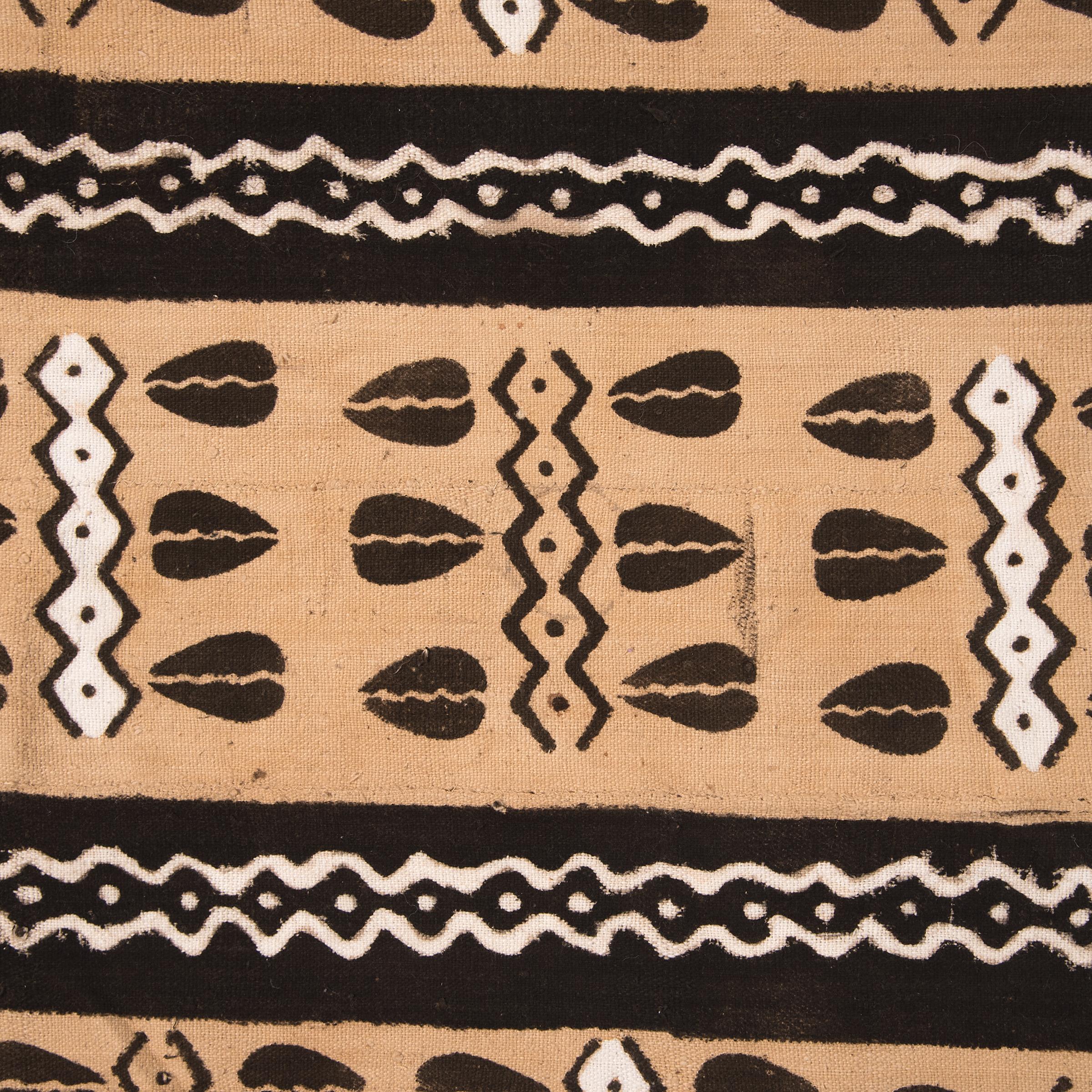 Commonly known as Bogolan or Bògòlanfini, this cotton textile was hand spun, handwoven, then dyed through a technique that has been passed down in the Bamana region of Mali for centuries. In traditional Malian culture, Bogolan, or mudcloth, is worn