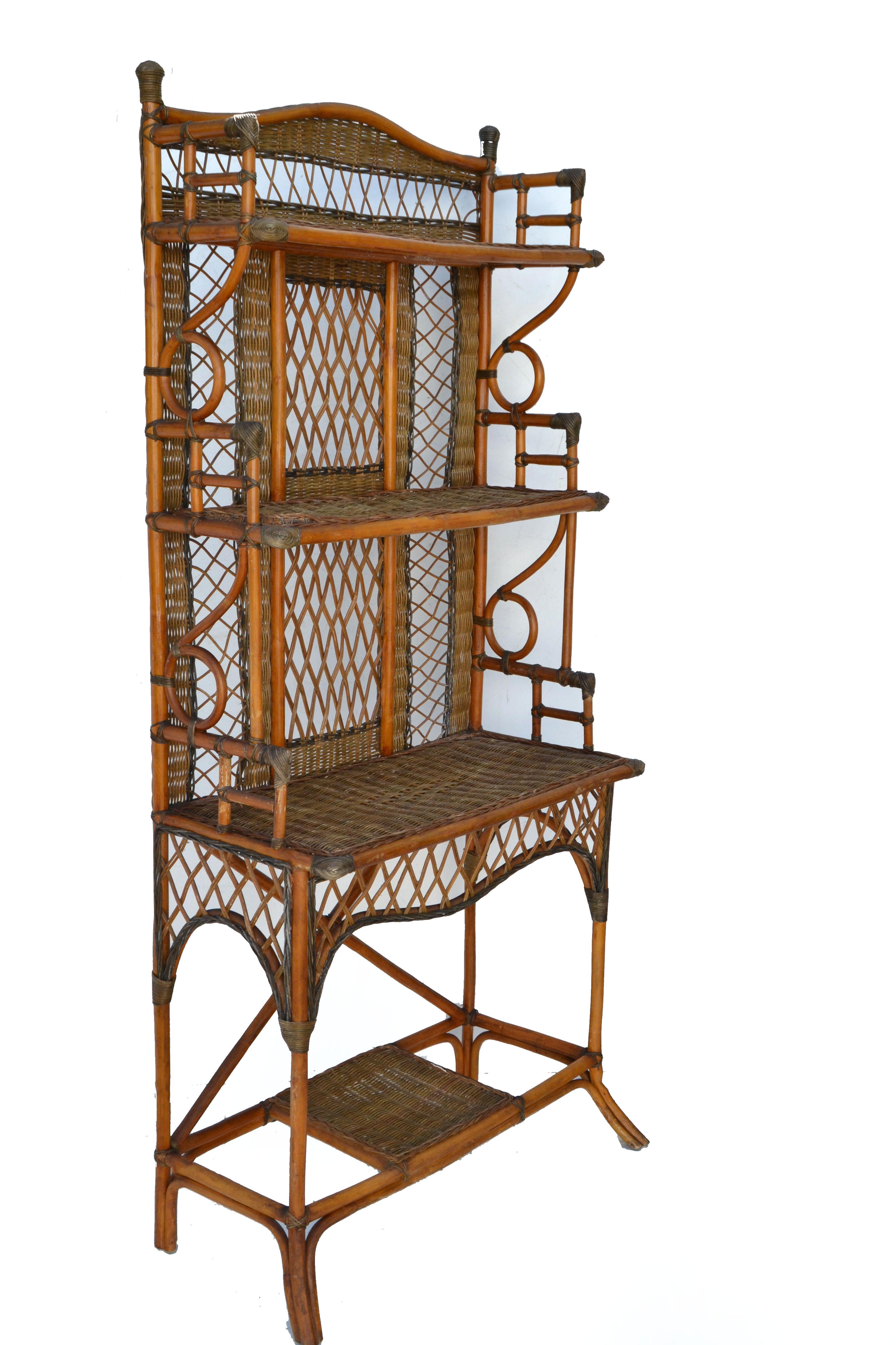 American Mid-Century Modern handcrafted 5 tier etagere, bookcase or cupboard made out of Bentwood Bamboo, Reed and hand woven cane shelves.
All original 1950s condition with some minor breaks, but firm and sturdy for your China, books or display