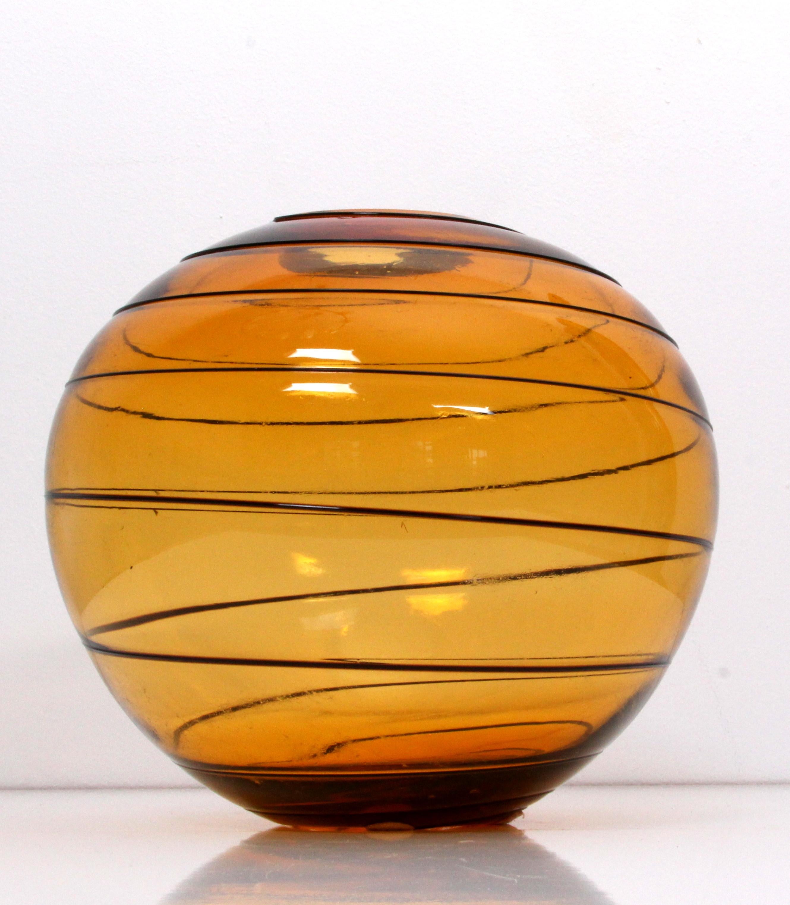 
Art Deco Vase with Spiral 
Bohemia 1930-1950

Art Deco vase, Bohemia around 1930s to 1950s.. mould-blown glass in transparent amber, with a black, spiral-shaped thread... the mouth is cut and has a diameter of 5 cm.... the beautiful object is in a