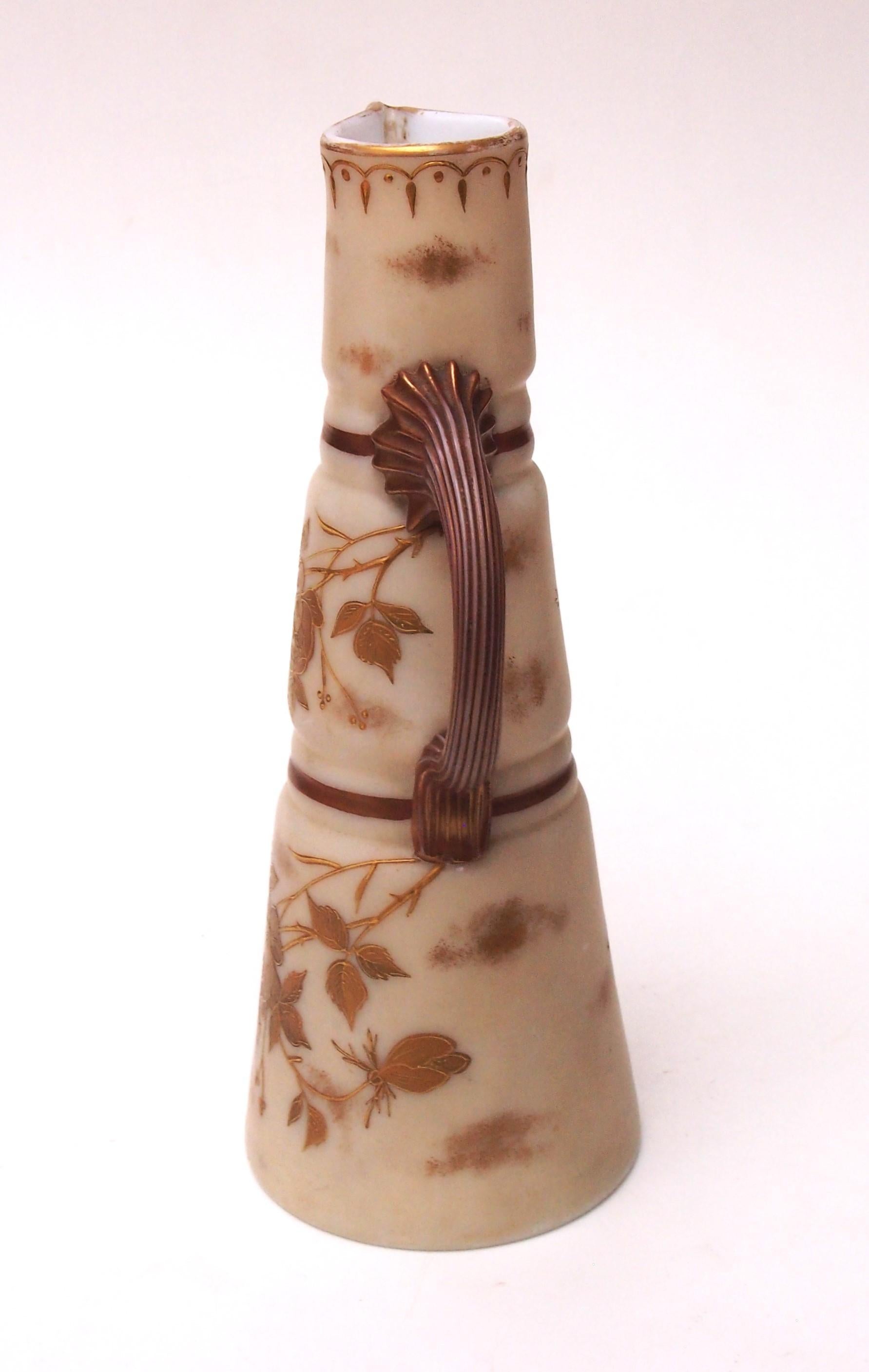 A rare Victorian Harrach Gilded Ivory coloured glass Jug in the classic shape of a claret jug  later this was more-commonly made in porcelain (in factories like Royal Worcester)  this is made in glass and has the shape and pattern codes to it's base