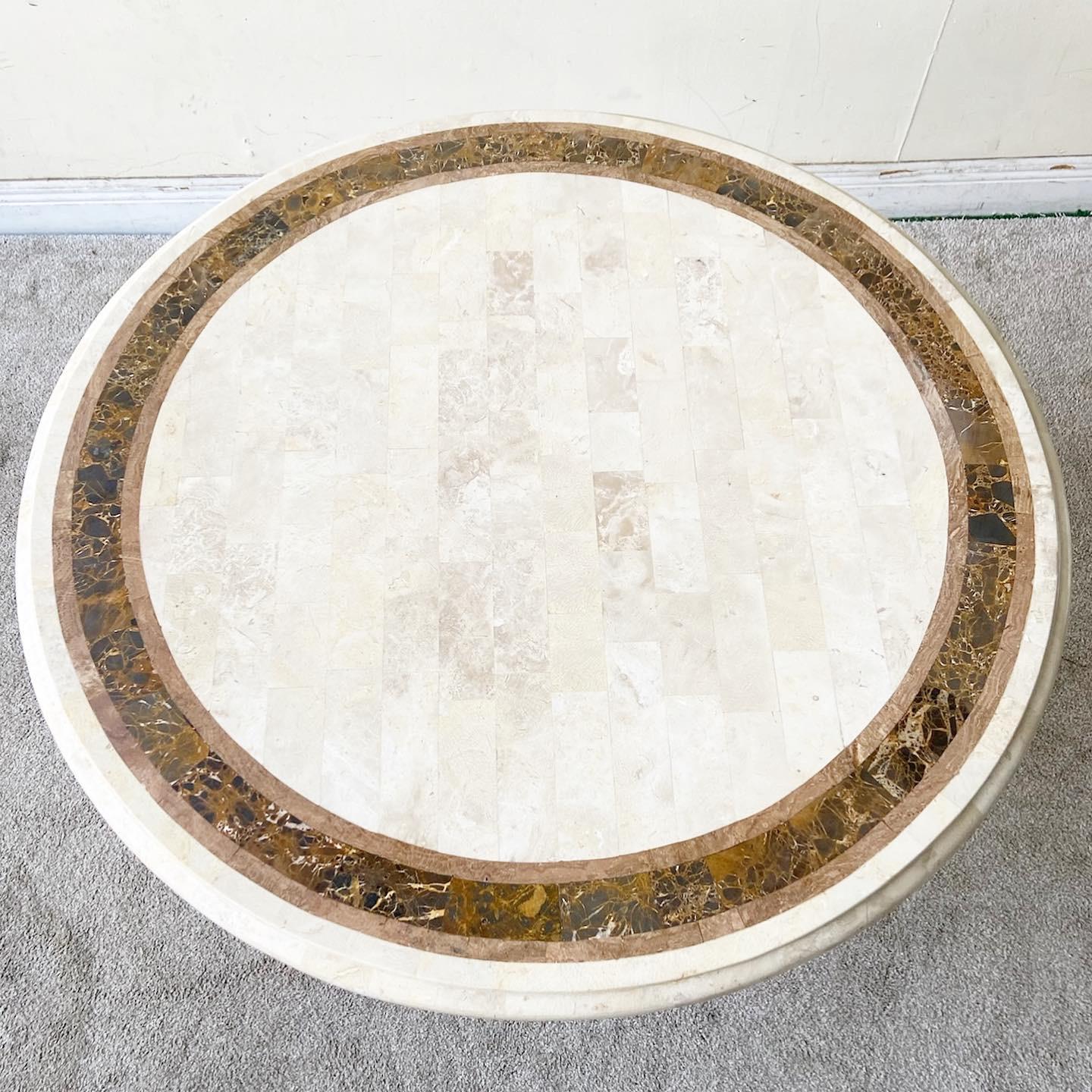 Exceptional vintage boho chic circular dining table. Features a tessellated polished stone top which rests on top on a bamboo rattan pedestal base.