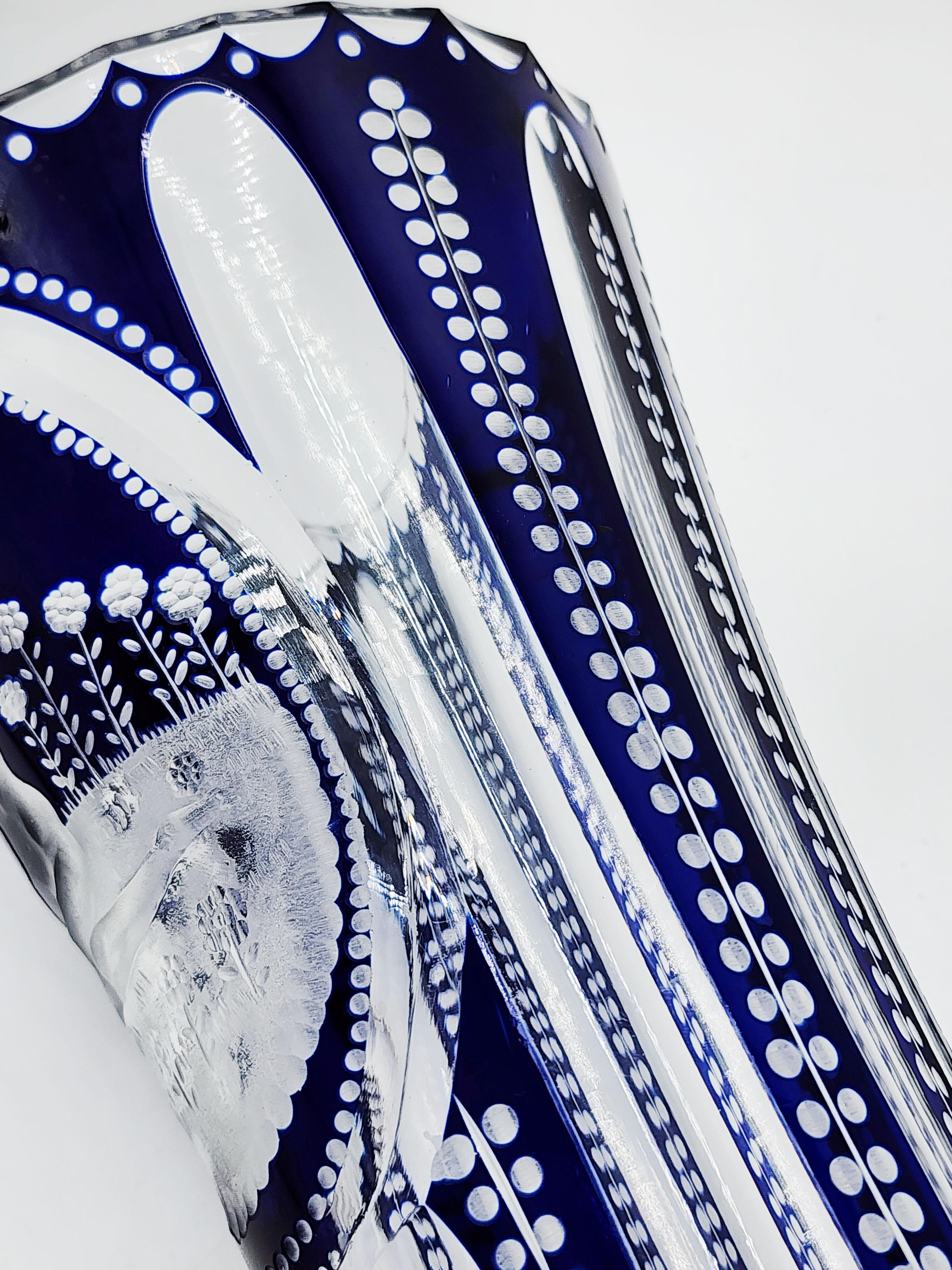 Bohemian Cut Crystal Vase in Cobalt Blue
This Bohemian crystal vase features a classic and elegant shape, with a base that is slightly narrower than the body, which widens towards the top and then narrows again at the neck. Its design is timeless,