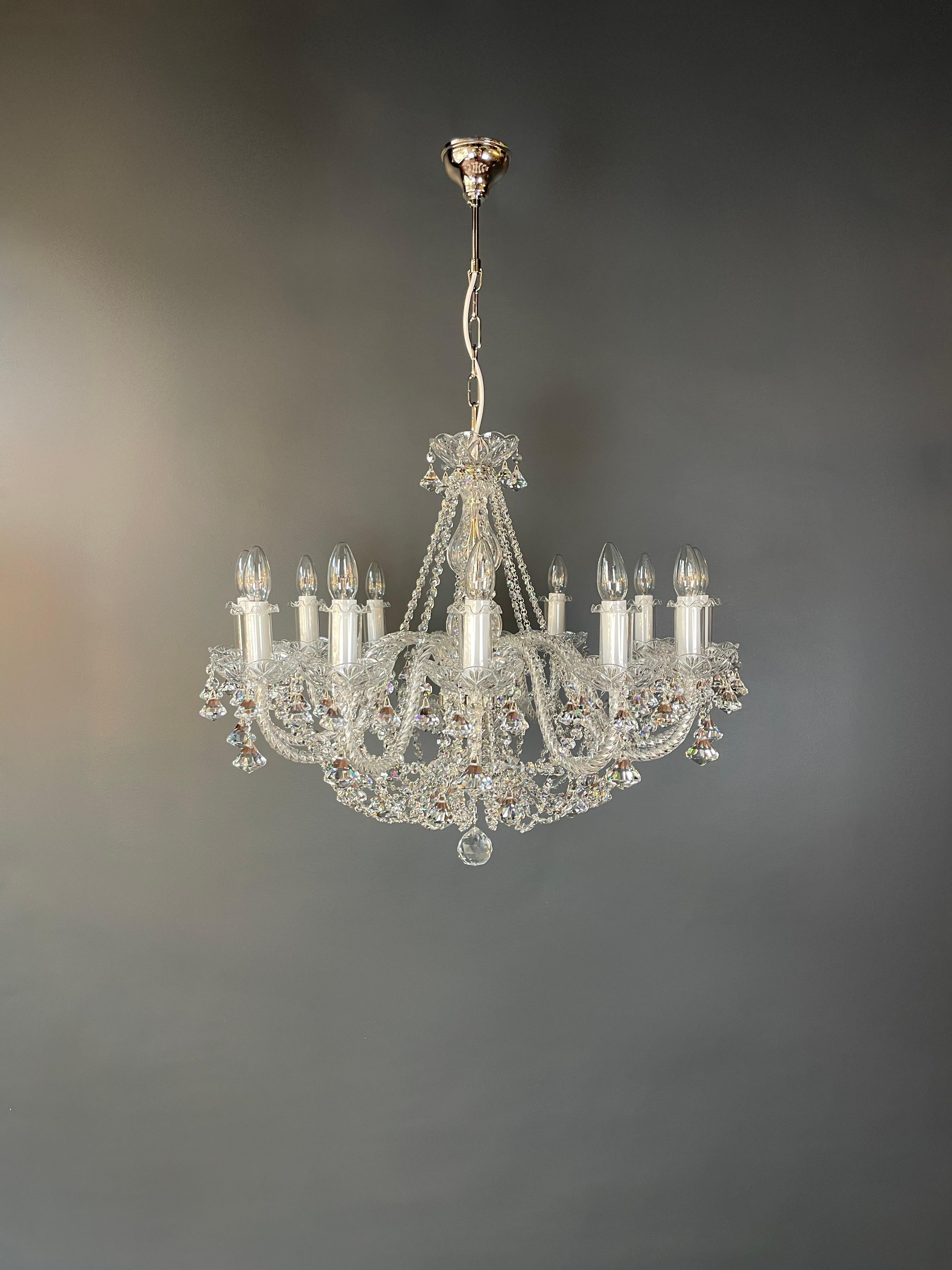 Introducing our stunning bohemian-style chandelier! This brand new in-house production has been meticulously crafted with great attention to detail, resulting in a neutral and airy centerpiece for any space that maintains its classic chandelier