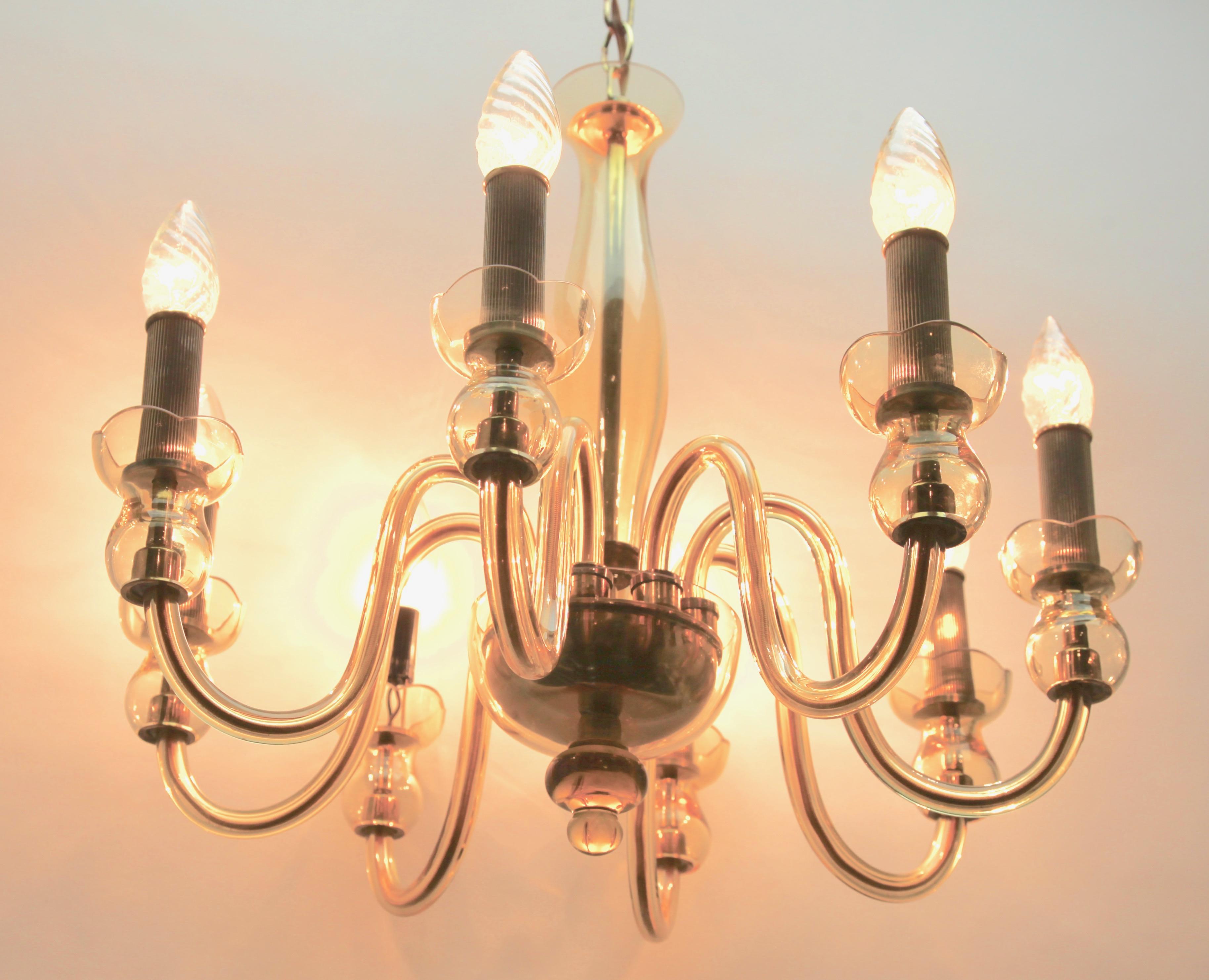 8 light chandelier made of hand blown smooth crystal glass infused 
with a combination of minerals to produce amber color;
Handcrafted in the Czech Republic.

As service: We can adjust the lamp Height for you in advance if needed. 
Every