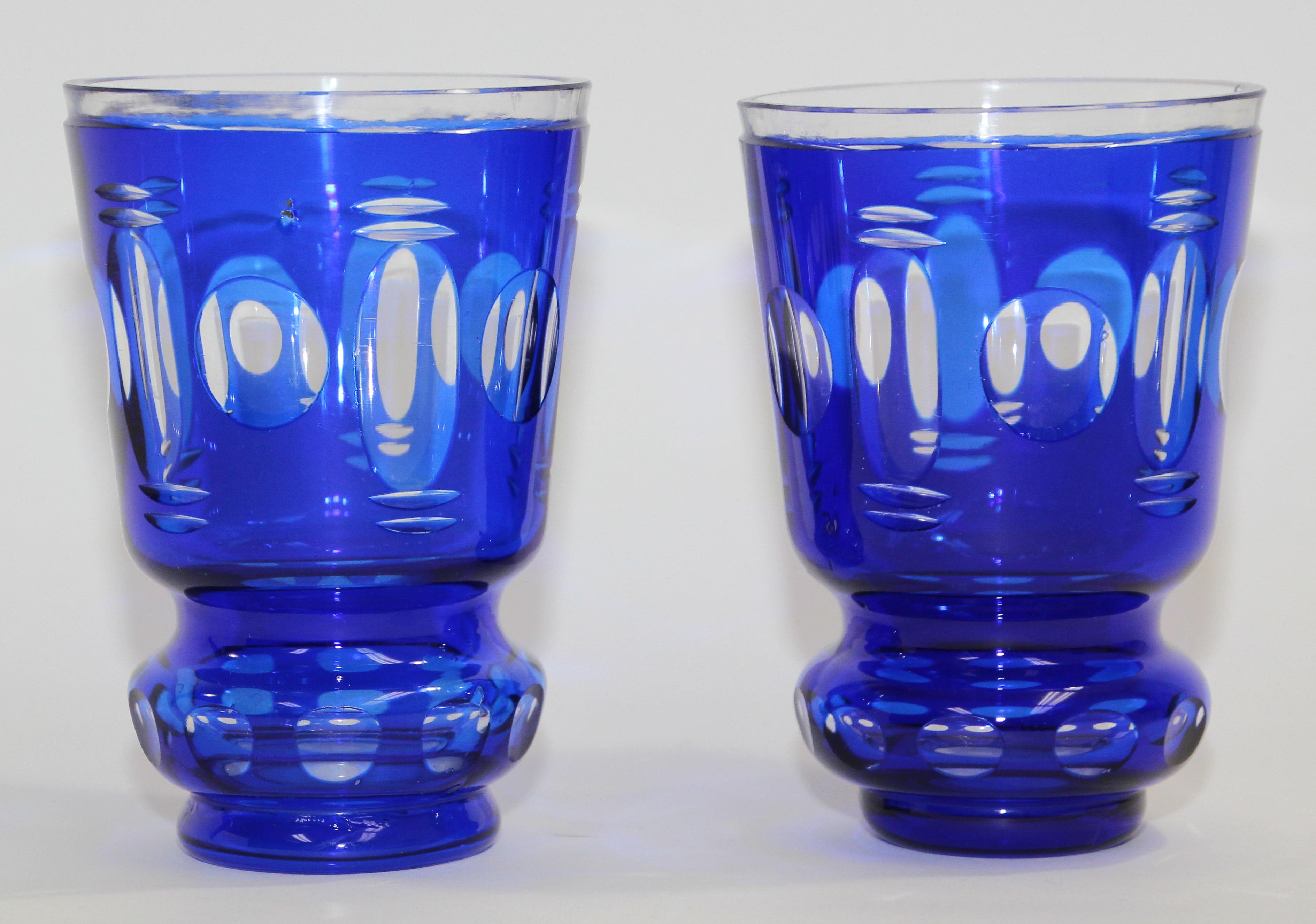 Cobalt blue cut to clear Bohemia glass crystal vases.
Cut to clear, cobalt blue Bohemian glass vase from Czechoslovakia. 
Beautiful etched designs throughout. 
Great to use with votive candle or as a decorative glass bowl or paper