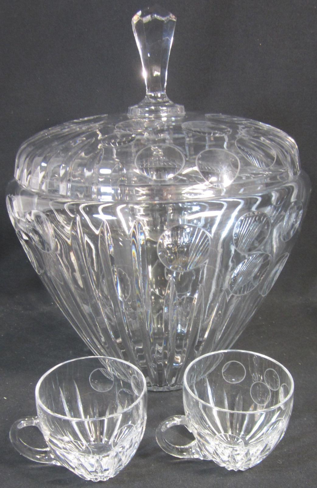 Bohemian crystal punch bowl and 10 cups with handles,
bowl 27 x 34 cm high, cups 8 x 8cm high.
Our eclectic stock crosses cultures, continents, styles and famous names.