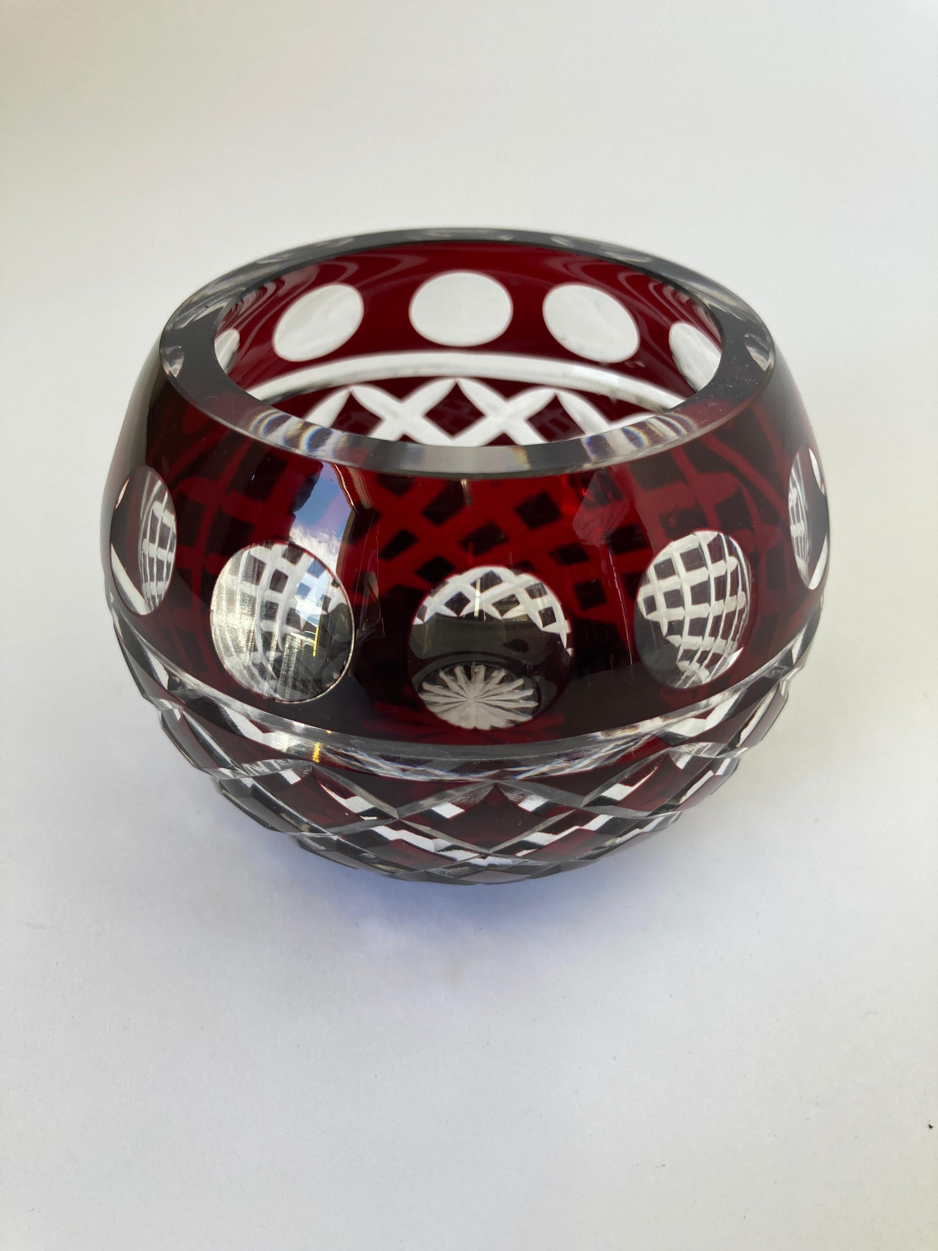 Bohemian cut crystal votive holder in cranberry color cut to clear.
Cut crystal from dark red wine color to clear
Crystal glass in excellent condition.
Great to use with votive candle or as a decorative glass bowl.
 