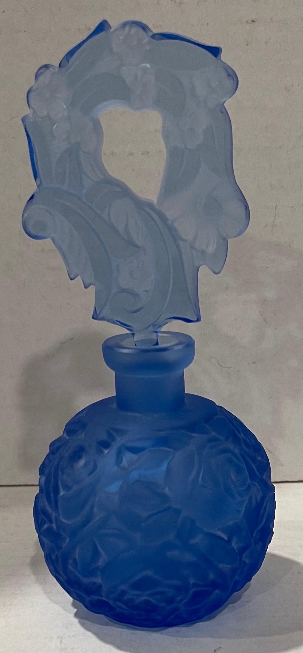 Blue Bohemian glass perfume bottle. Frosted glass body with cut glass stopper. No makes mark or brand stamp.