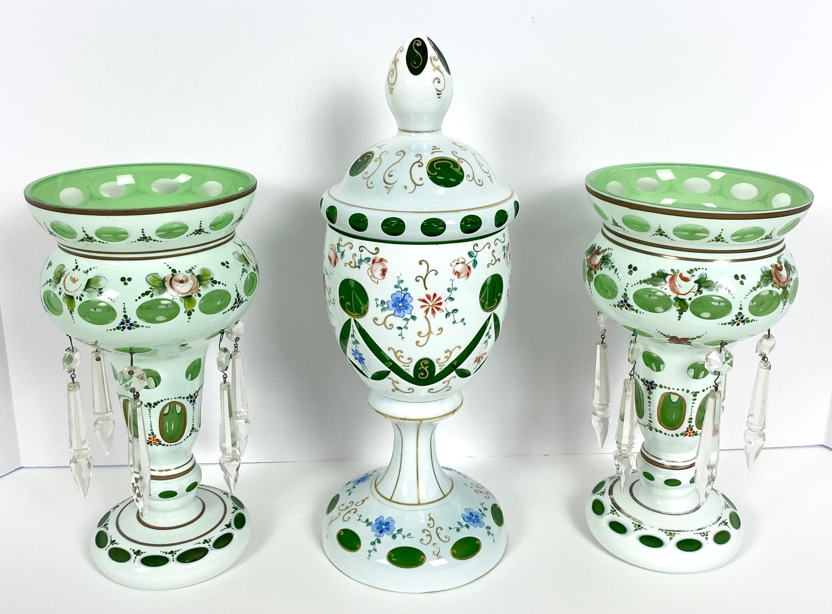 Green and White Bohemian Czech Glass
Floral Hand Painted Vintage Bohemian Czech Glass 

Set of 3 decorative objects featuring hand painted flowers, and gold scrolling designs. 
All are in perfect vintage condition.  
Two pieces measure: 5