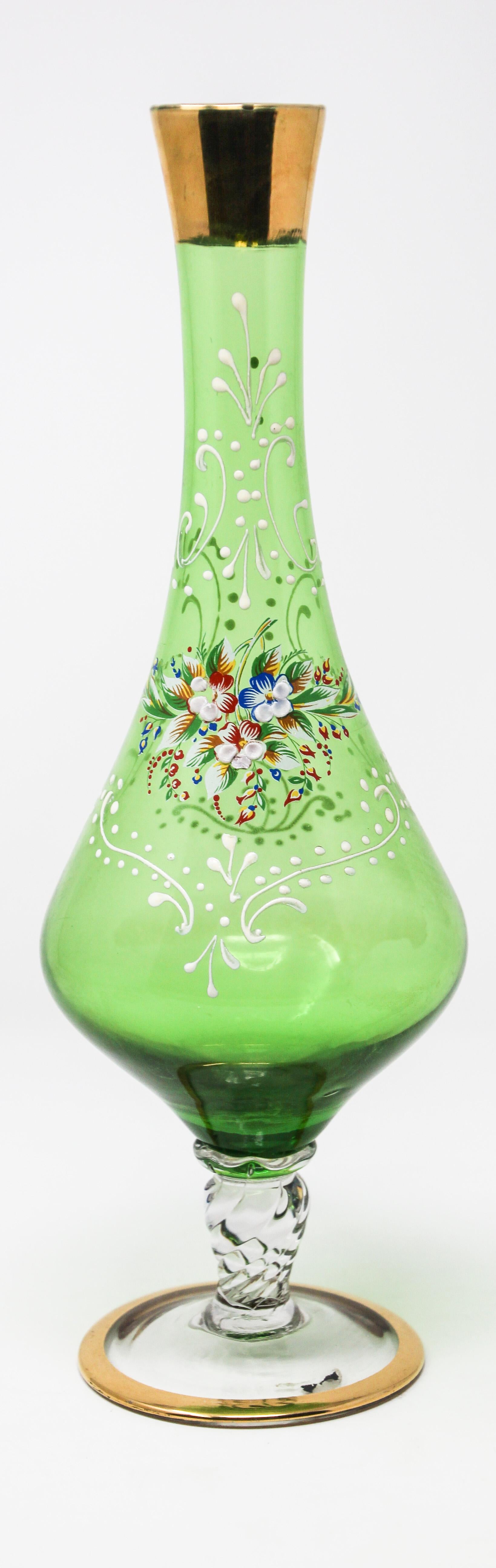 Bohemian emerald green glass gilded and enameled vase Moser style with hand painted gold floral design.
A boho glass art piece handcrafted by master glassmakers in the Czech Republic.