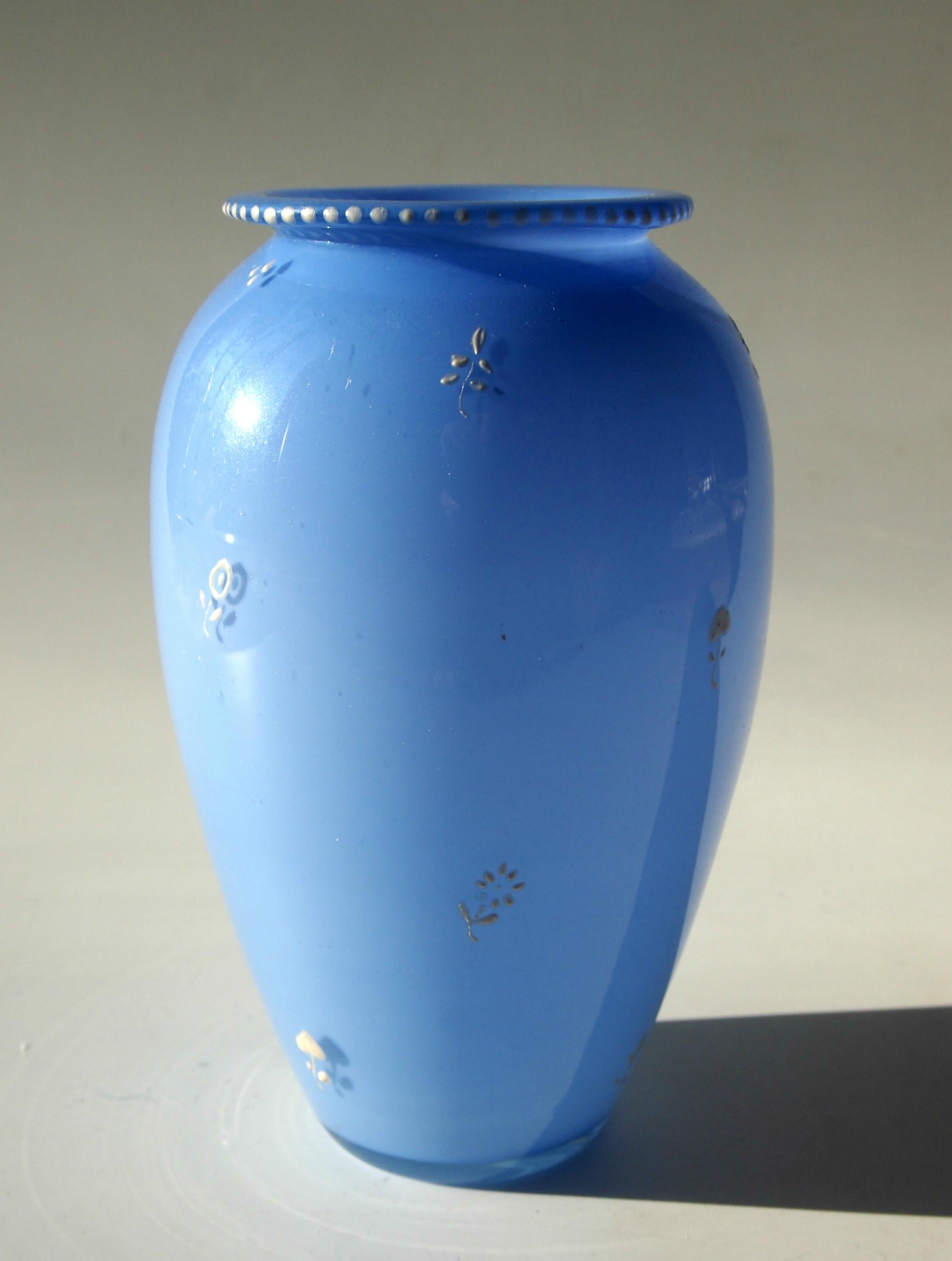 Rare blue tango vase by Loetz enameled in white and designed by one of their greatest designers - Dagobert Peche. 

Loetz was by far the most important art glass house in the Bohemian region in the first quarter of the 20th century.

Dagobert