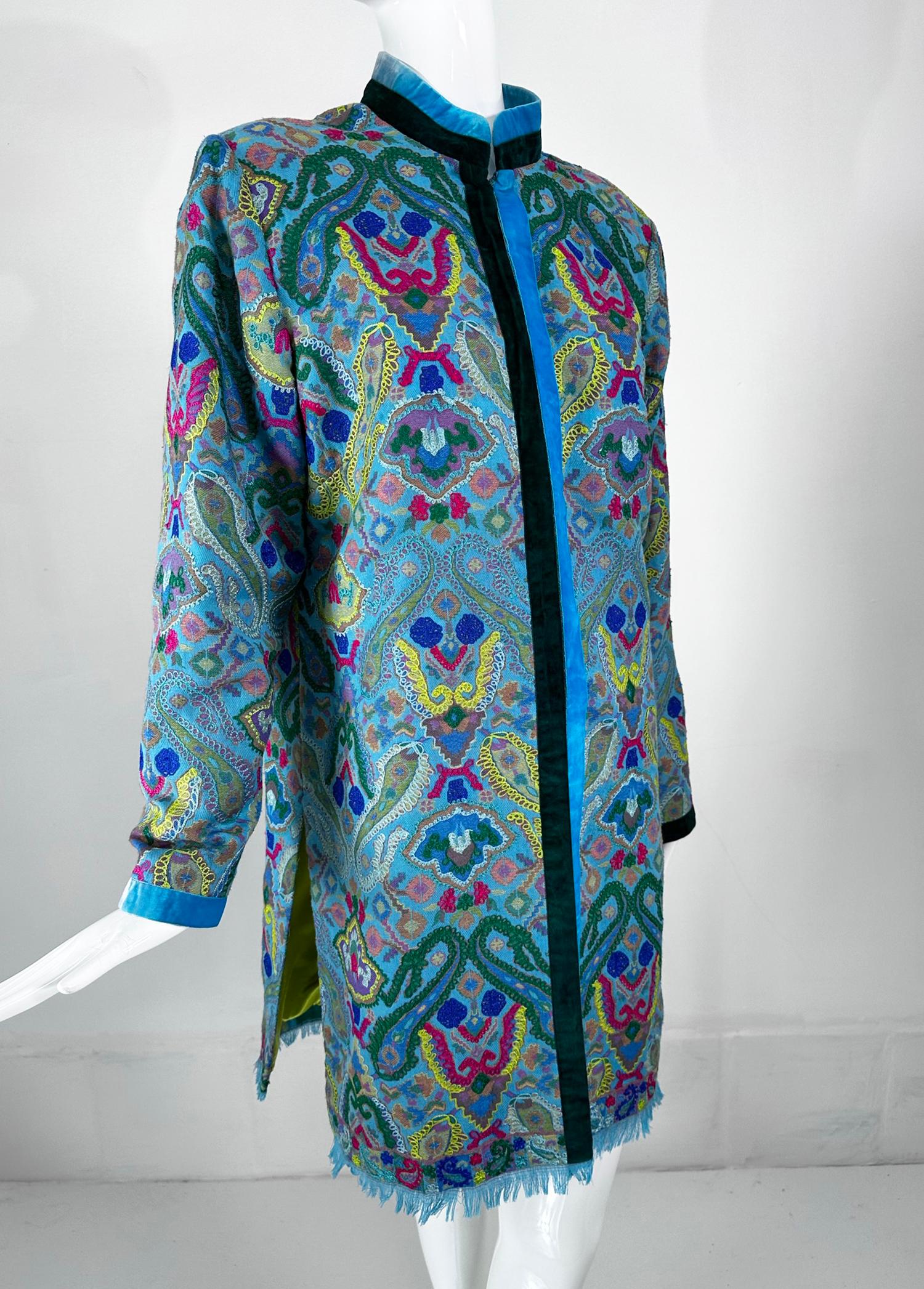 Bohemian ethnic woven & embroidered wool fringe hem coat. This beautiful coat is 100% lightweight wool, it's woven in a traditional design in beautiful colours. Throughout it is over embroidered in colourful chain stitch. Turquoise, purple, red,