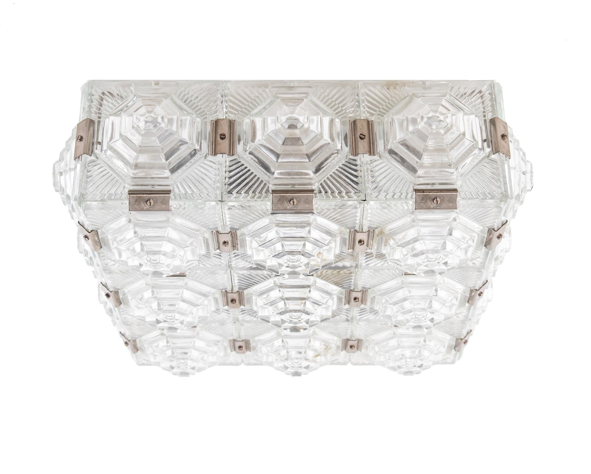 Elegant bohemian flush mount ceiling lamp composed of thick textured glass elements with chromed fittings on a white lacquered brass frame. Manufactured by Kamenicky, Czechoslovakia in the 1960s. 

Style: mid century, modernist. 
Colors: clear,