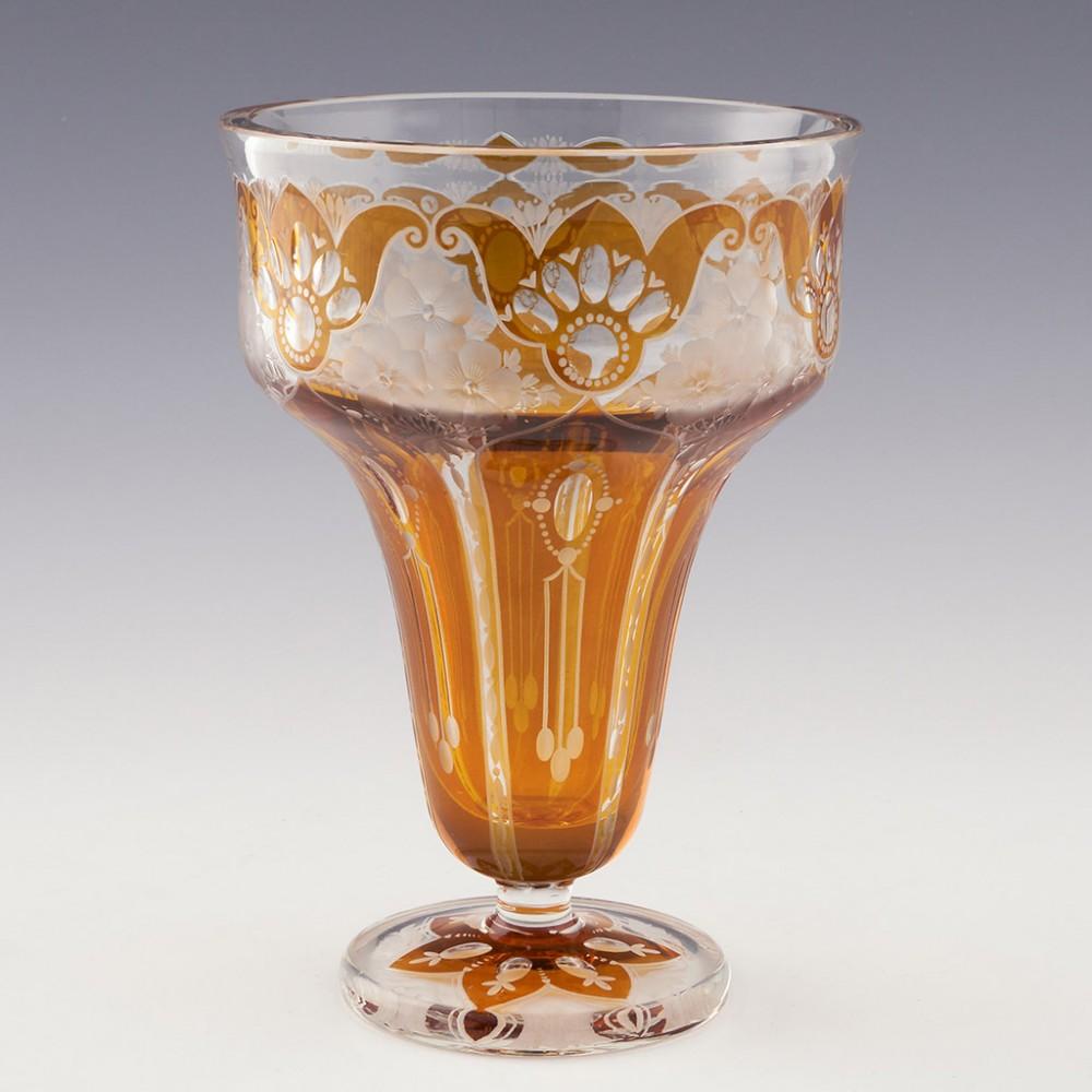 Bohemian Footed Vase-Amber Flashed over Clear-Haida-Steinschönau-Oertel, c1910

Additional Information:
Heading : Bohemian Footed Vase - Amber Flashed over Clear
Date : c1910
Origin : Bohemia
Bowl Features : Inverted bell shaped body with