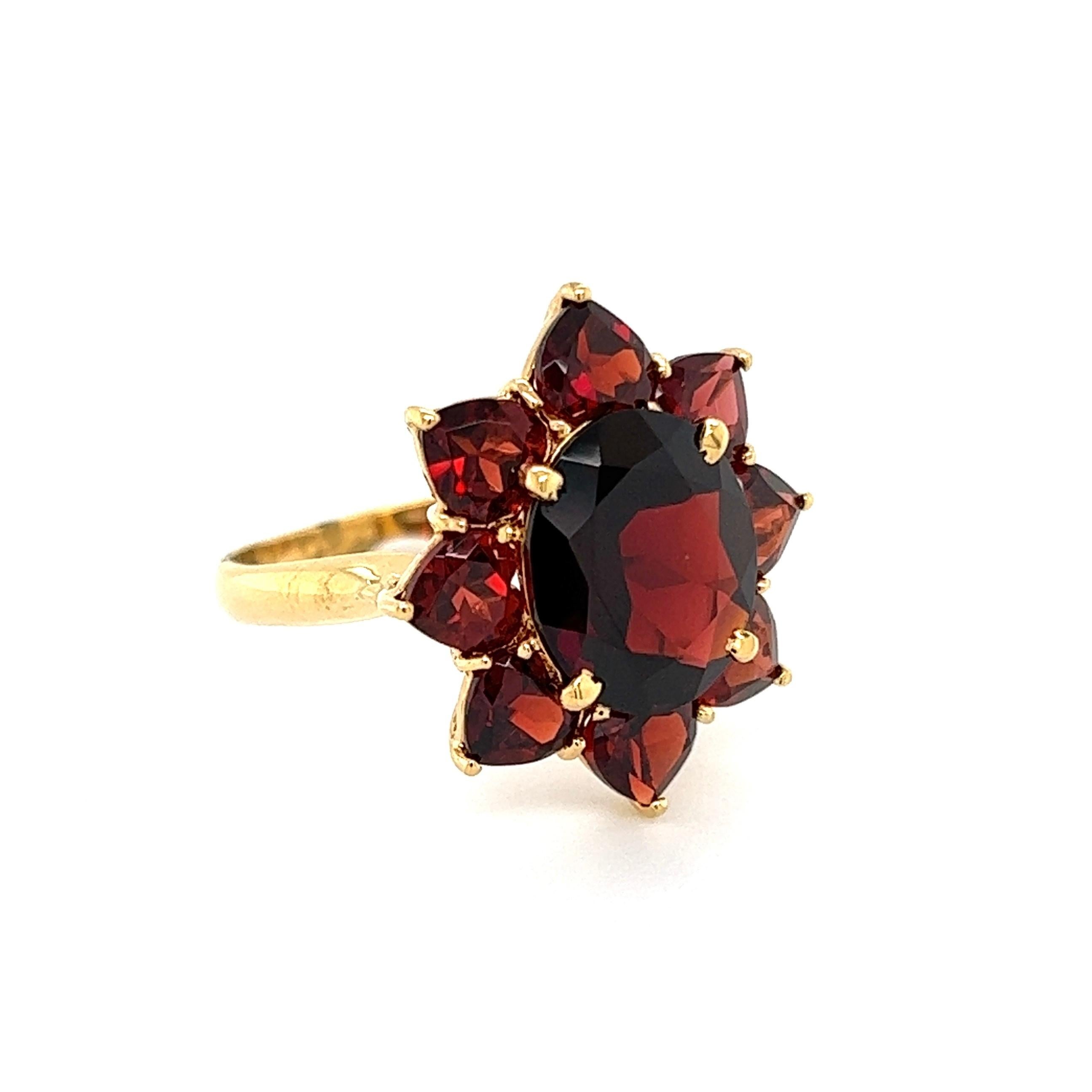 Beautiful Bohemian Garnet Cluster Ring, Hand set with weighing approx. 10.00tcw. The ring is Hand crafted in 18K Yellow Gold. Measuring approx. 1.12” L x 0.85” W x 0.92” H. Ring Size 10, we offer ring re-sizing. The ring is in excellent condition