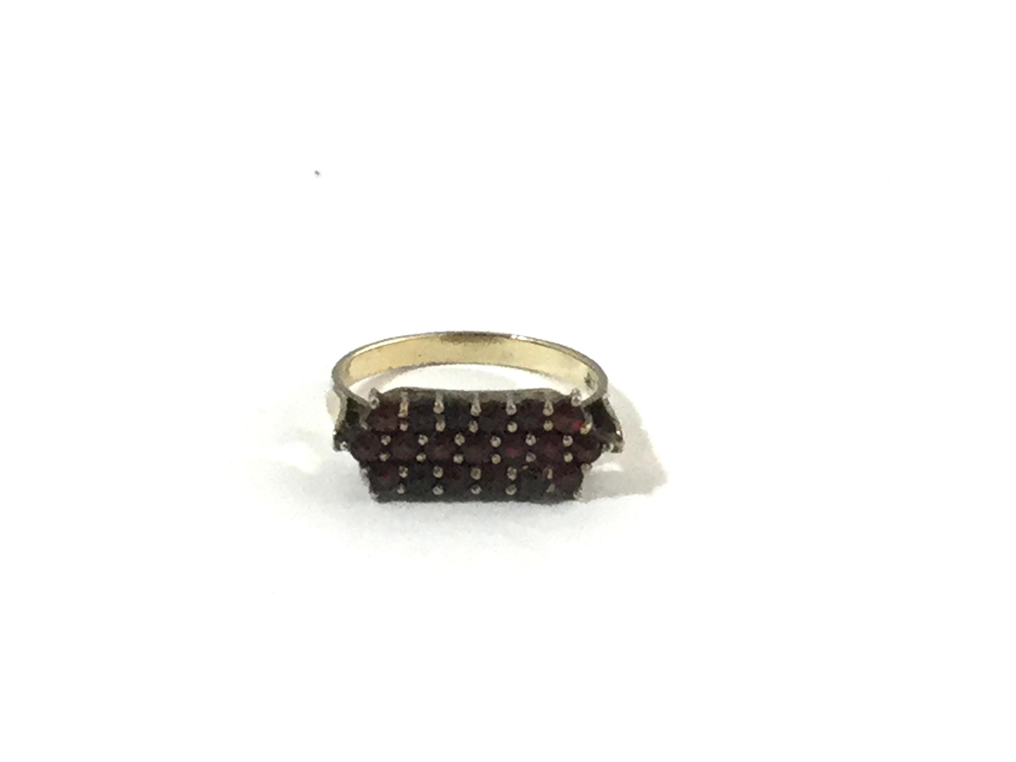 Bohemian Garnet Sterling Silver Ring

This is a lovely sterling silver garnet Bohemian Ring with a gold wash.

Measurements: Size 6 3/4. Front of ring measures 5mmL x 17mmW. Shank measures 1mm. Ring sits 2mm high off the finger.

Weight: 2.4 g / 1.5