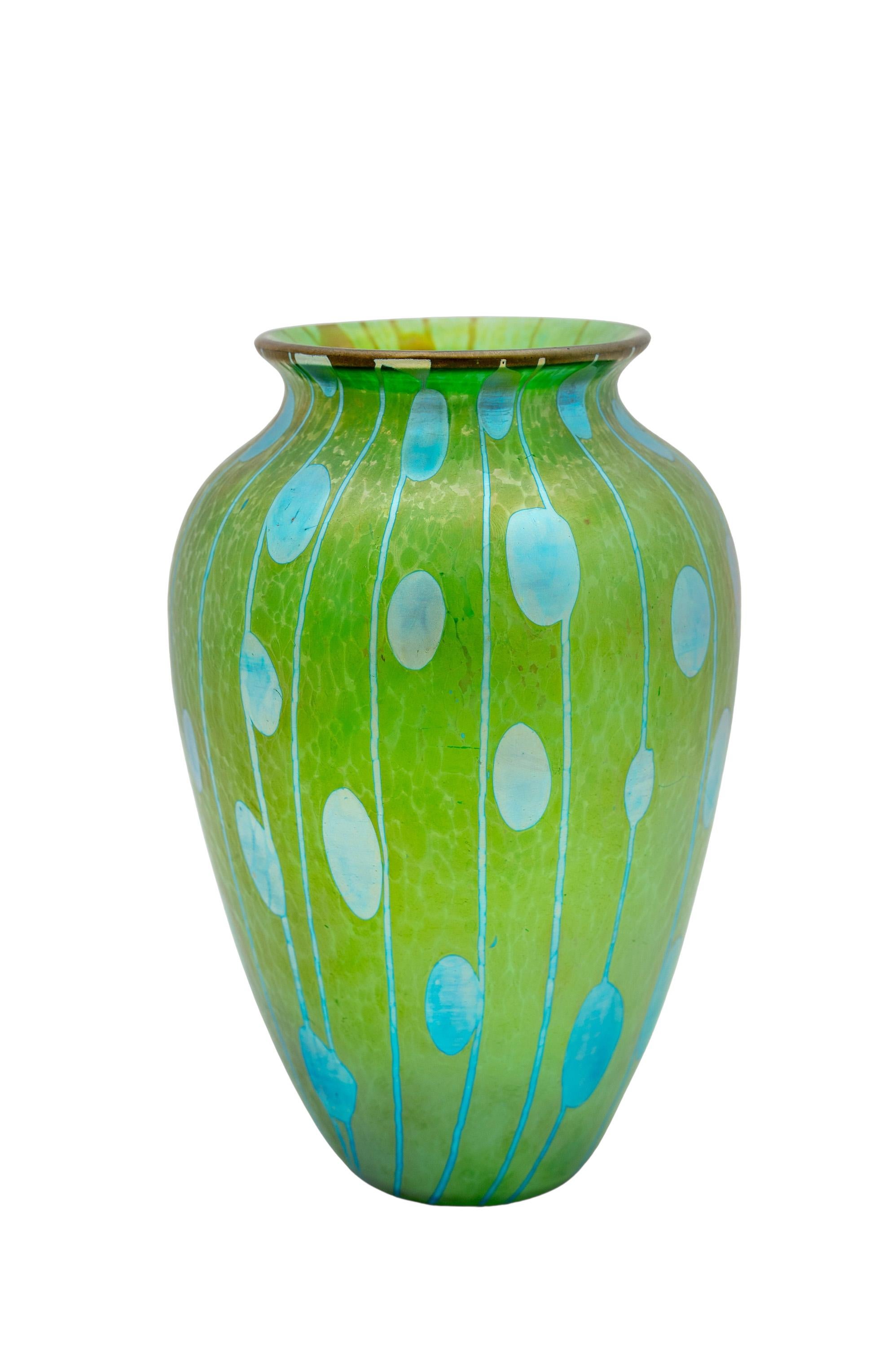 Bohemian glass vase, manufactured by Johann Loetz Witwe, Flecken und Streifen decoration, ca. 1900, Green, Blue, Viennese Art Nouveau, Jugendstil, Art Deco, art glass, iridescent glass.

This vase stuns with its bright green color and specs of blue.