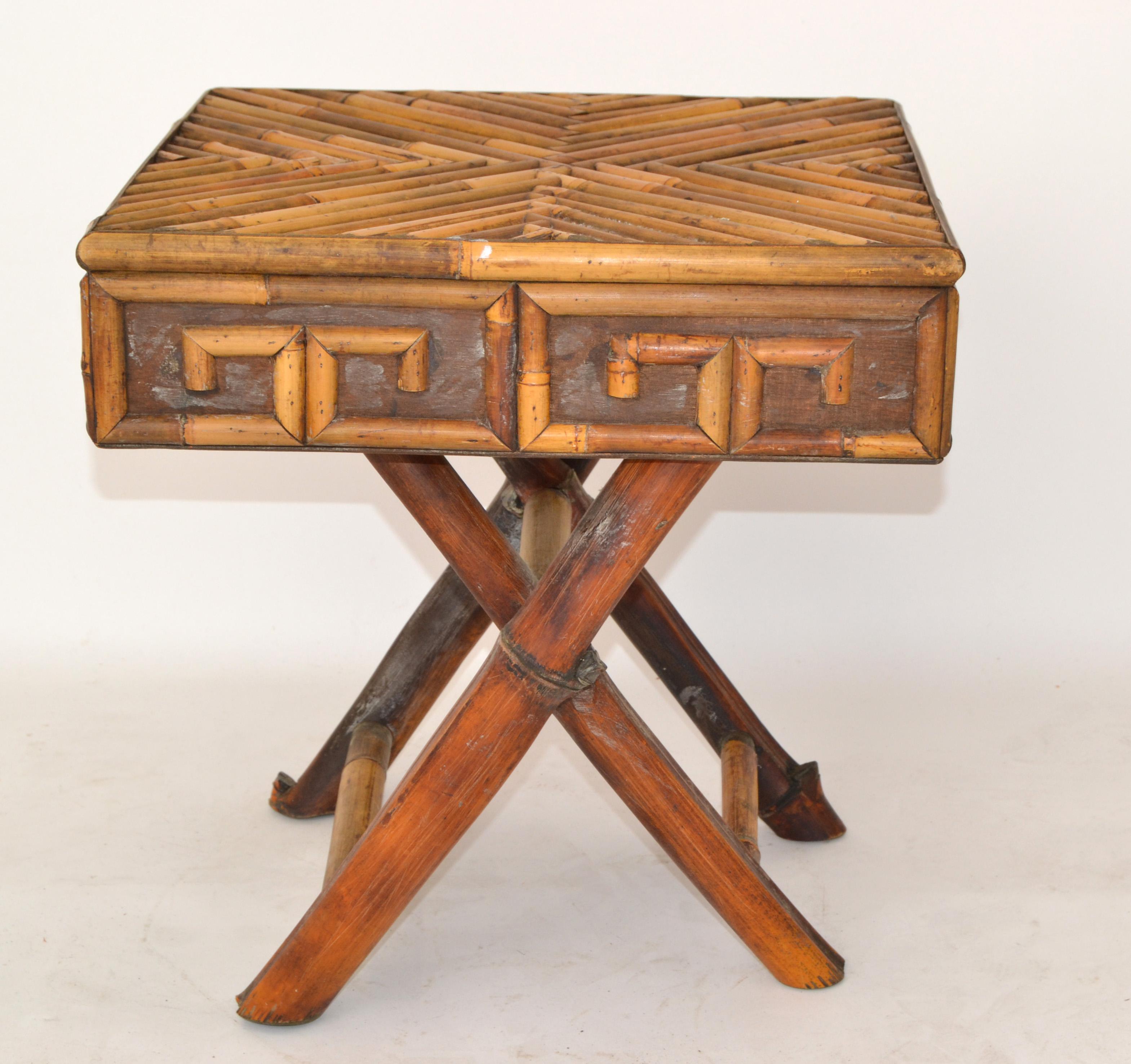 1960s Single Bohemian style Mid-Century Modern handcrafted bamboo and cane square folding Side, Drink or End Table.
Strands of Bamboo in geometric shapes on Top and the Apron is decorated in Bambo Greek Key Pattern.
The folding Table is sturdy and