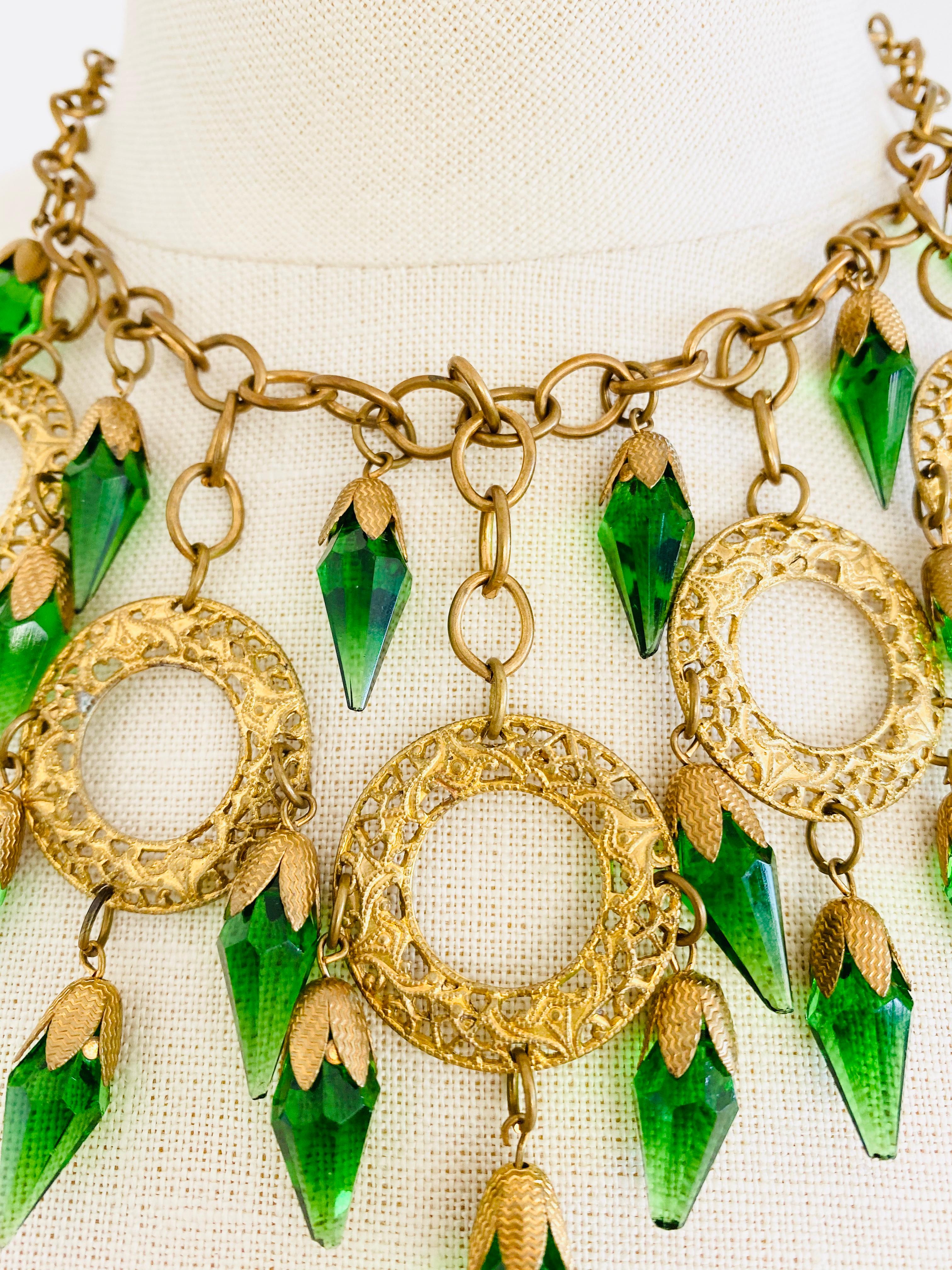 Vintage Bohemian necklace featuring faceted green glass and brass or gold plated metalwork. 

Size: The necklace measures 16