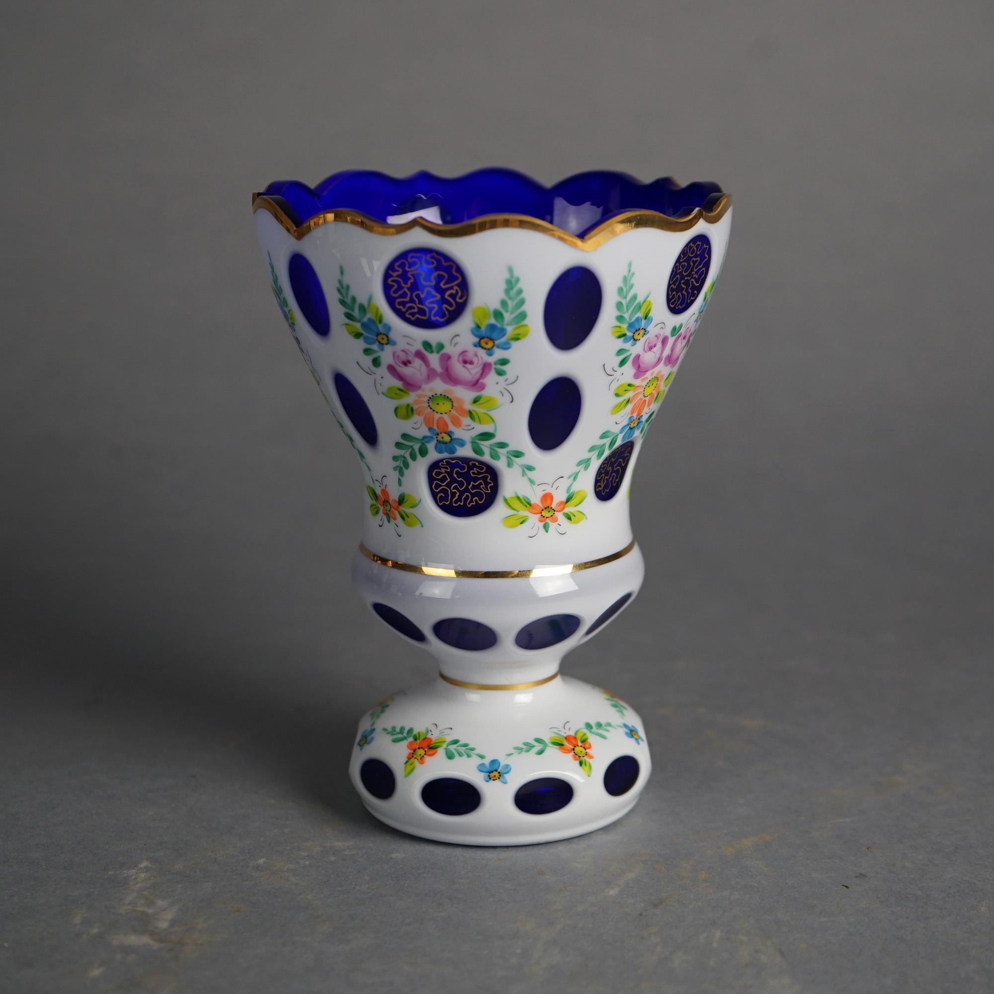 Bohemian Hand Painted Floral & Gilt Highlighted Cobalt Cut to Clear Glass Footed Vase 20thC

Measures - 6.5