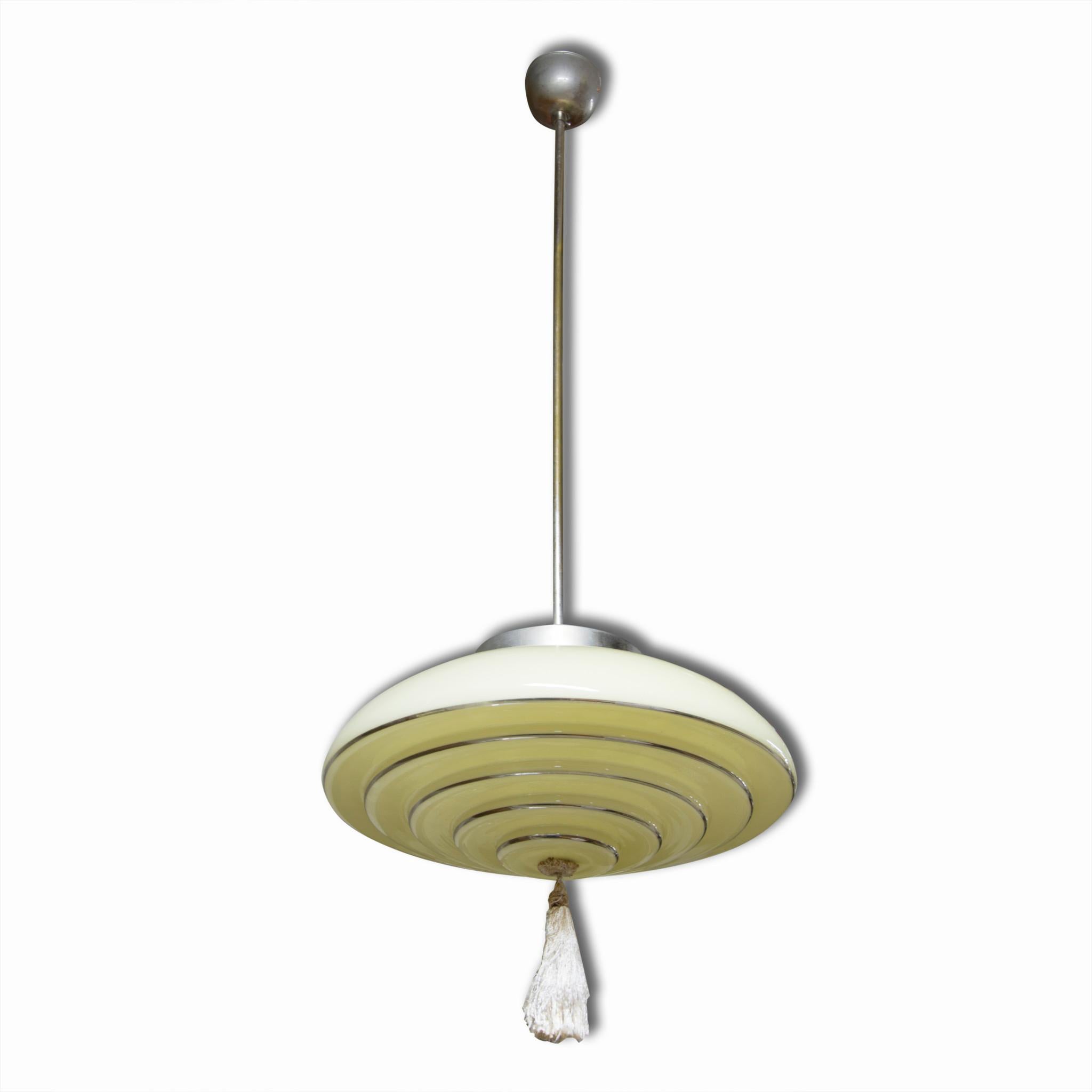 Functionalist glass pendant lamp/ Fixture, produced by Napako. Chromium plated rod, 1930s. In very good Vintage condition. Original wiring. Functionality has not been tested. If you are interested, we will provide a new wiring.


  