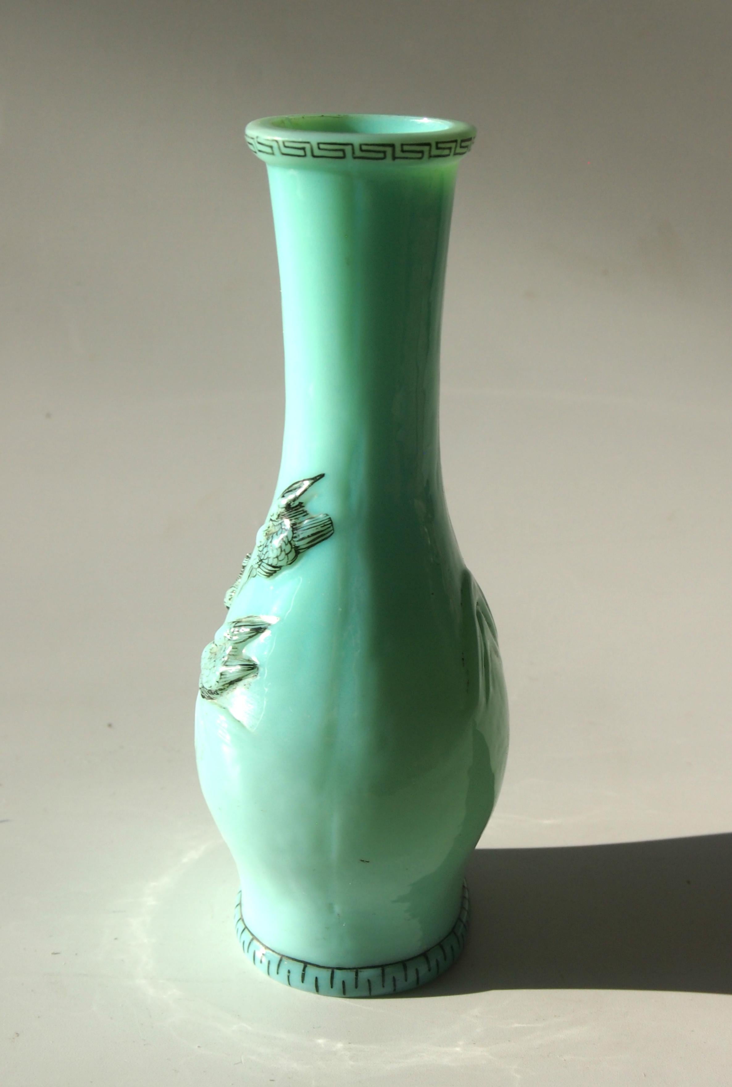 Small Harrach chinoiserie vase made to imitate Chinese Jade, mould blow and decorated with a Greek key pattern, flying birds and a mountain range -an example from the same mould resides in the Harrach depository.

Harrach has been the backbone of