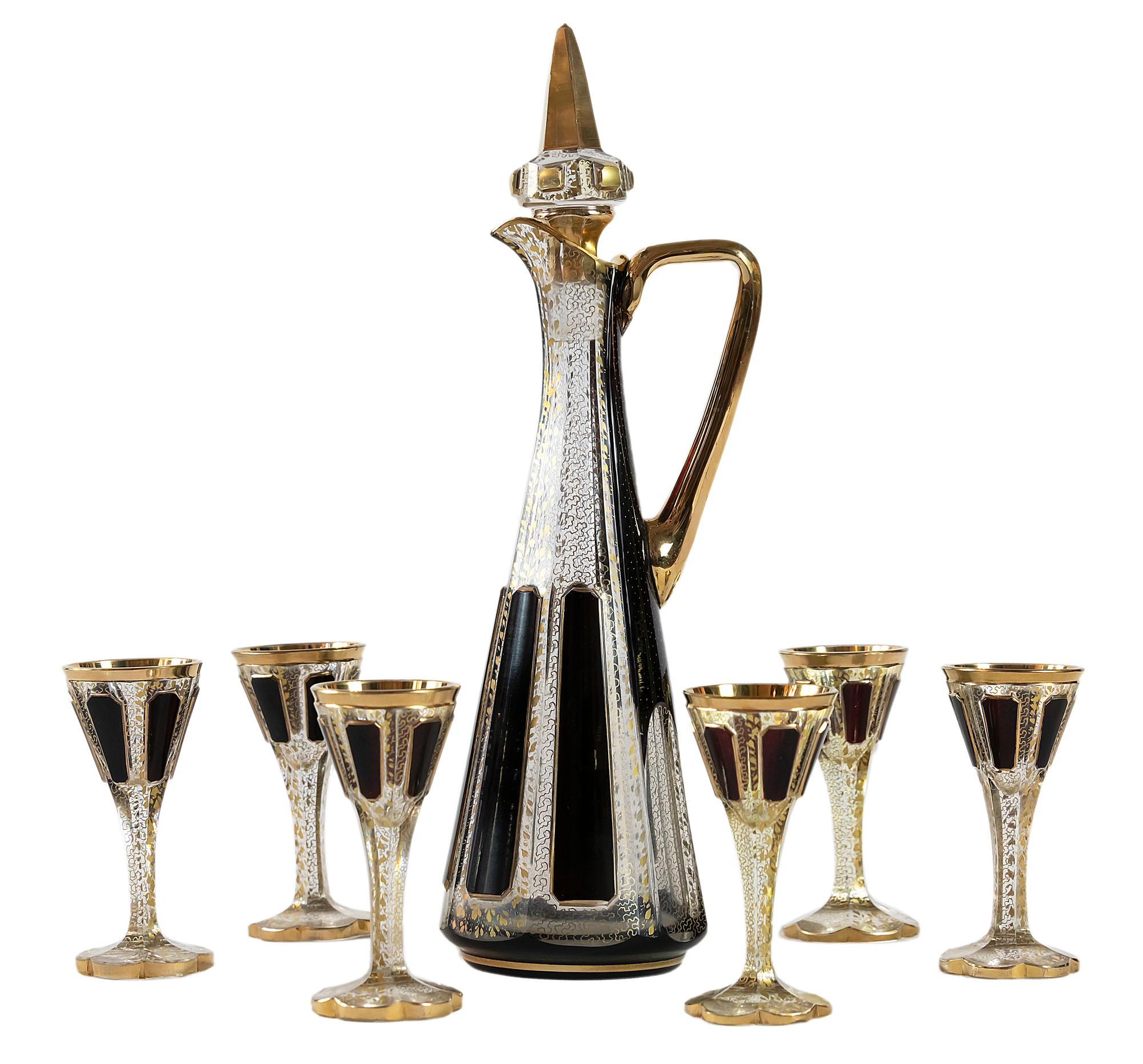 Bohemian cut crystal liqueur set decorated with dark red glass and hand painted in gold.
The set includes 6 pieces of goblets, 1 piece decanter.
Very good condition.
Measures: Decanter high 32 cm, goblet high 10 cm.

 