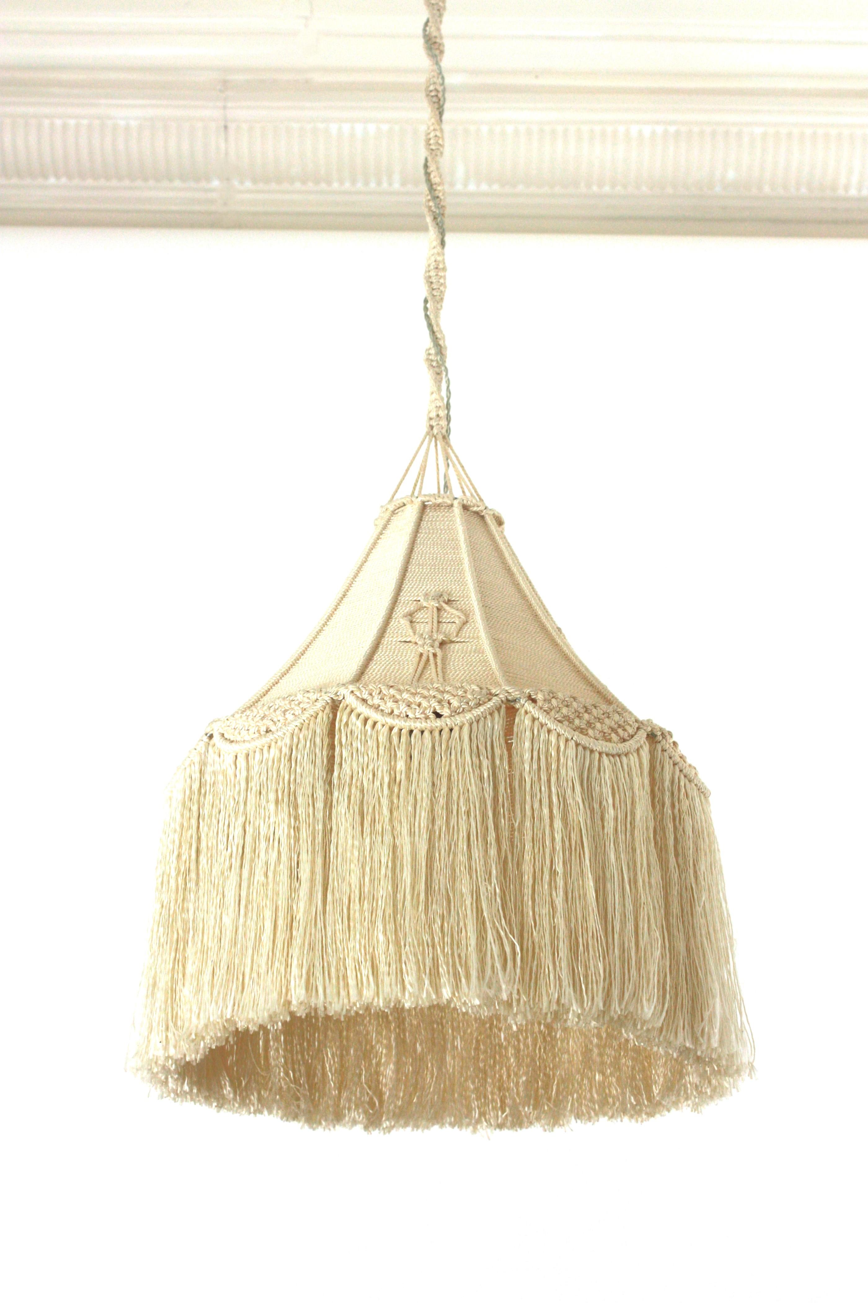 Spanish Hand Knotted Macramé Cord Pendant Light-Ceiling Hanging Lamp
Lovely vintage original macramé fiber handcrafted cone shaped l lantern / pendant, Spain, 1960s-1970s.
This eye-catching lamp features a conical lampshade with hand braided and