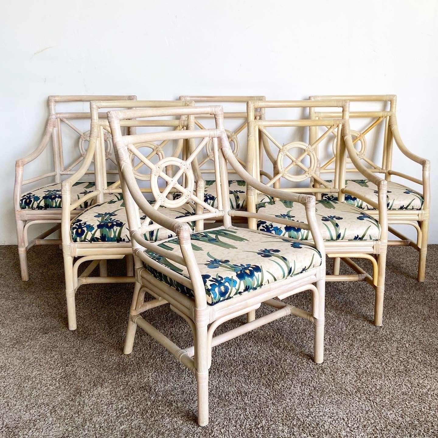 Exquisite set of 6 rattan dining armchairs crafted in the manner and style of McGuire by Shelby Williams. They feature a bullseye target design on the square back splat. Graceful arms conjoin to a generous seat with green and blue organic