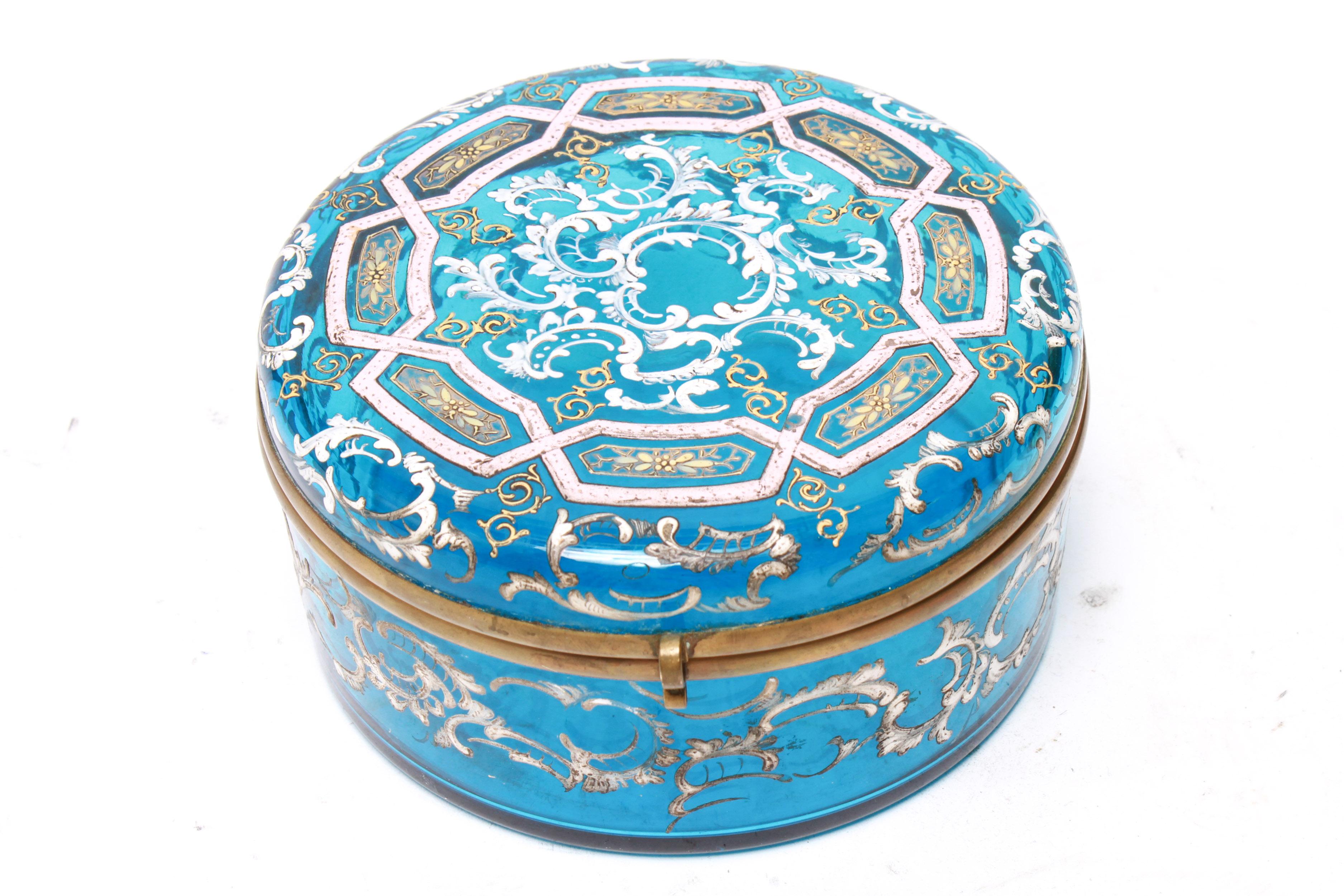 Moser style Bohemian large lidded vanity box in blue glass with enamel decoration and with brass hardware. The piece is in great vintage condition with age-appropriate wear.