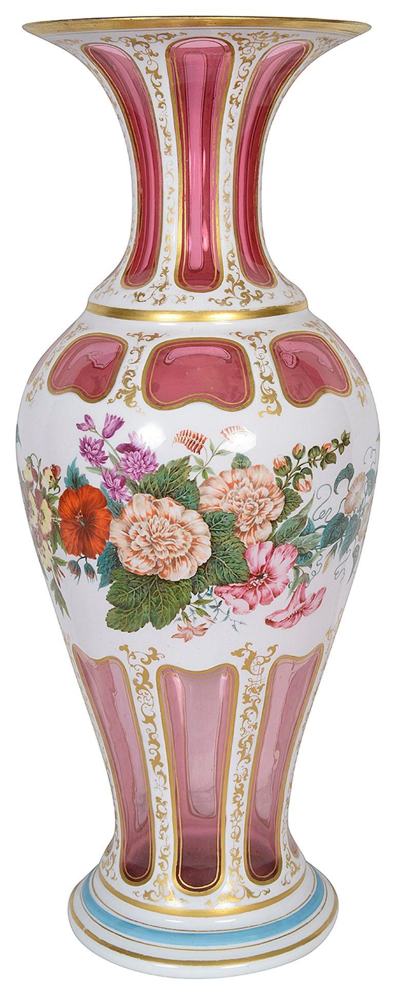 A very decorative and impressive late 19th Century Bohemian Ruby and Opaline glass vase, having gilded highlights and wonderful bold coloured flowers.


Batch 75 57053 HEHKN