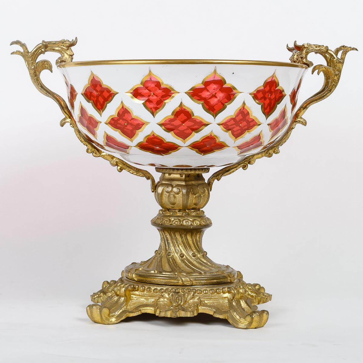 Bohemian Opaline Overlay and Gilt Bronze Bowl, 19th Century.

A 19th century Napoleon III period cup in Bohemian opaline overlay and gilt bronze.
H: 28cm, W: 36cm, D: 25cm