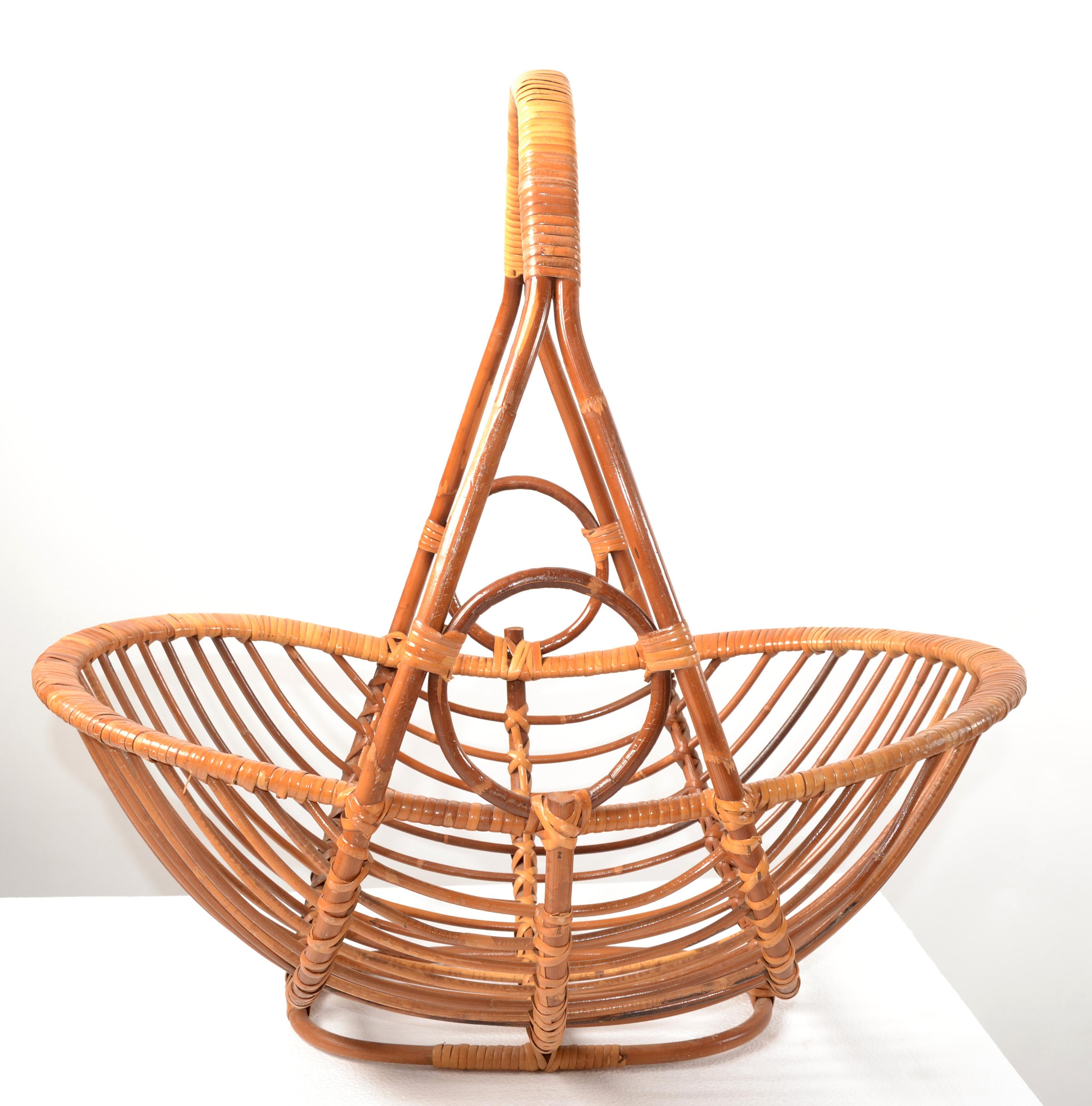 Boho Chic handwoven Bamboo, Reed and Caning Magazine Stand, Newspaper Basket, Book Rack made in the Mid-20th century.  
Open Weave with lots of details and technics. Stunner Craftsmanship.
This Basket is very useful and adaptable due to its design