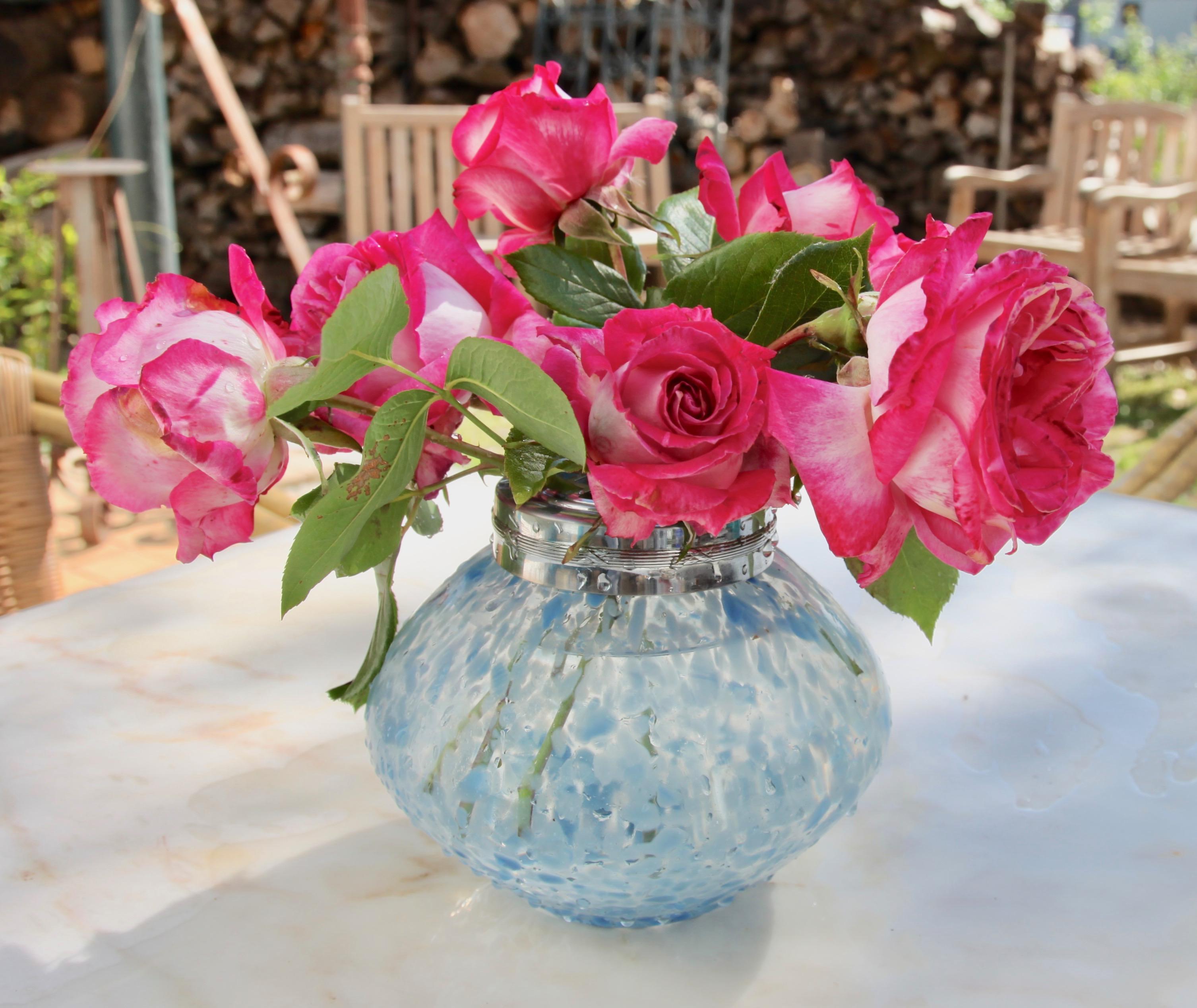 Subtle, light-blue, hand blown splatter glass vase in the Art Deco style. This design for vases is often called 'Pique fleurs' or 'rose-bowl' and is supplied with a fitted metal grille to support stems in an arrangement. The body contains a good