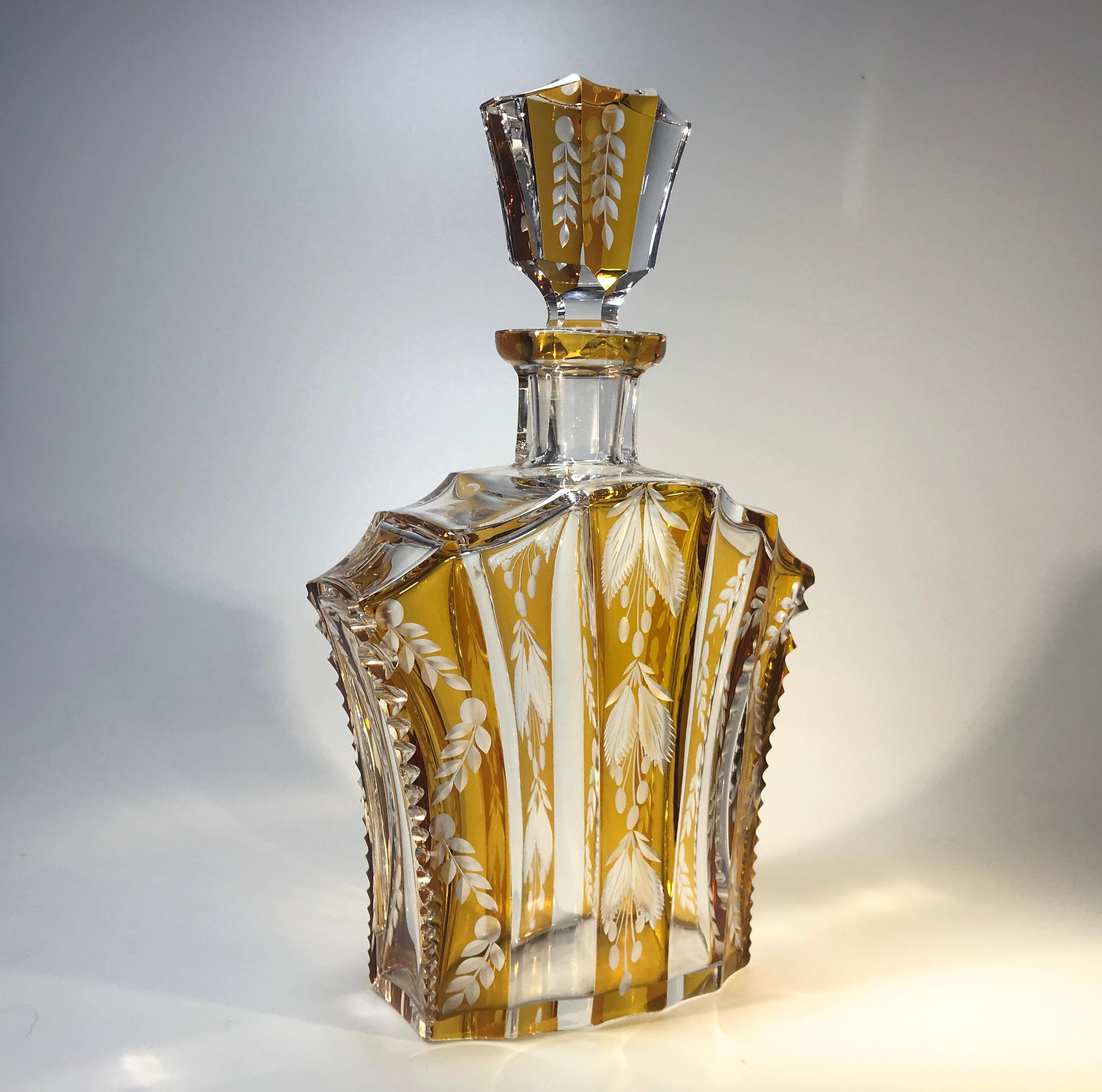 Splendid Bohemian flashed and engraved decanter set from the 1930's
A superbly stylish shaped decanter with faceted stopper, decorated with a rich amber flashed floral pattern
Complete with four petite companion glasses. Each glass holds approx