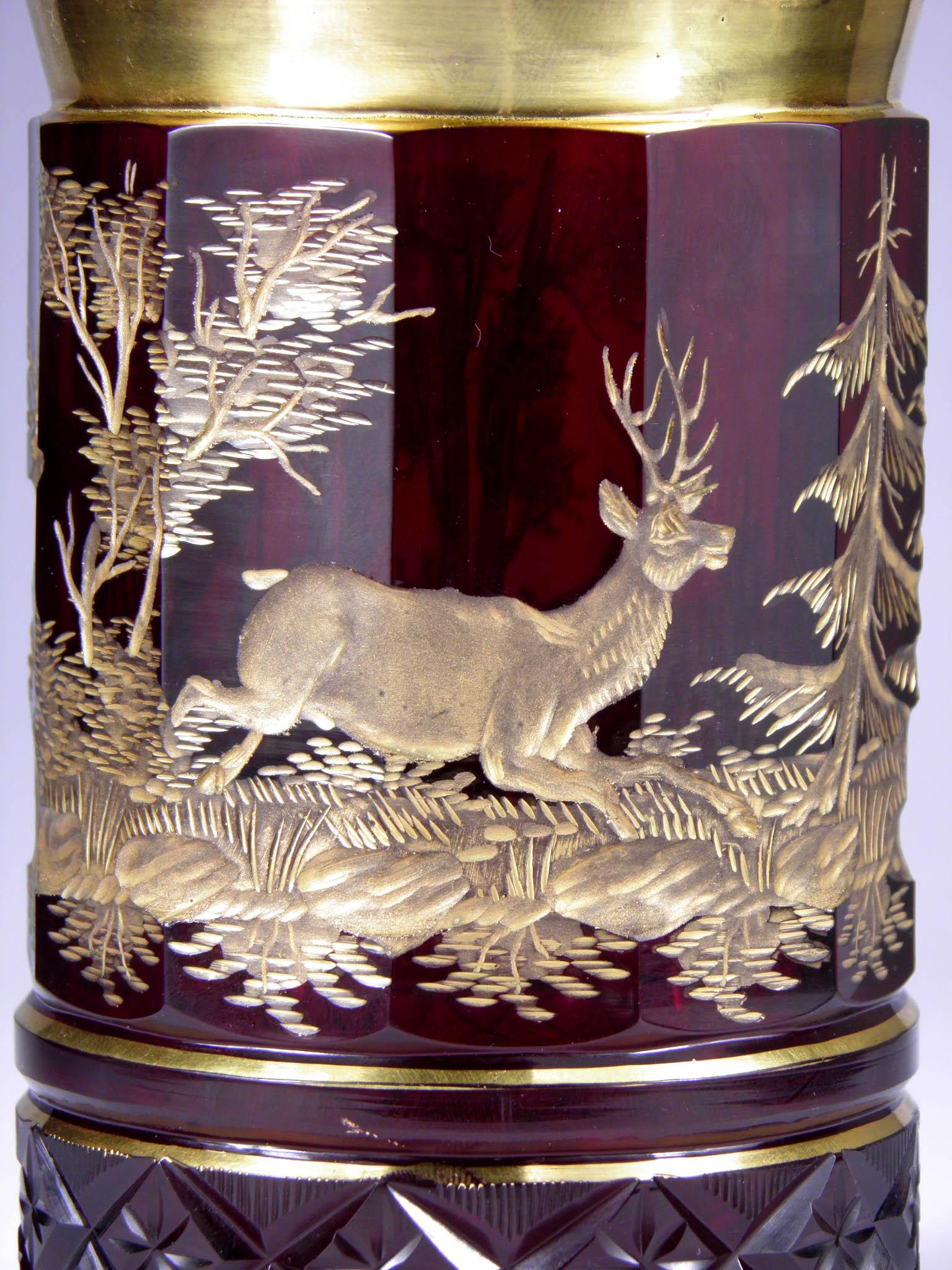 Ruby glass, handcut Gilded engraving with hunting motive.