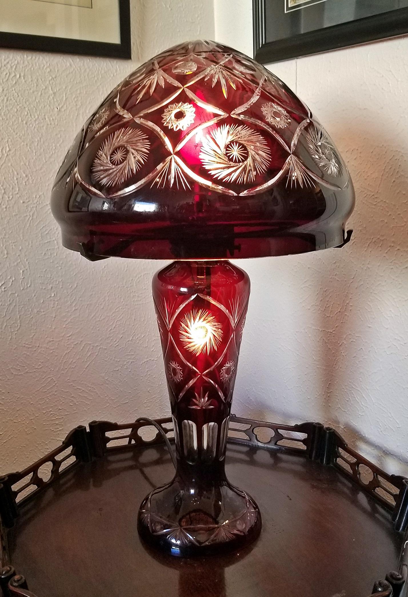 Gorgeous large Bohemian cut-to clear crystal table lamp.

20th century, fully re-wired.

Ruby red crystal which is then cut to reveal clear glass design underneath…..the effect is gorgeous!

Large bulbous cover/shade of fluted base.

Highly,